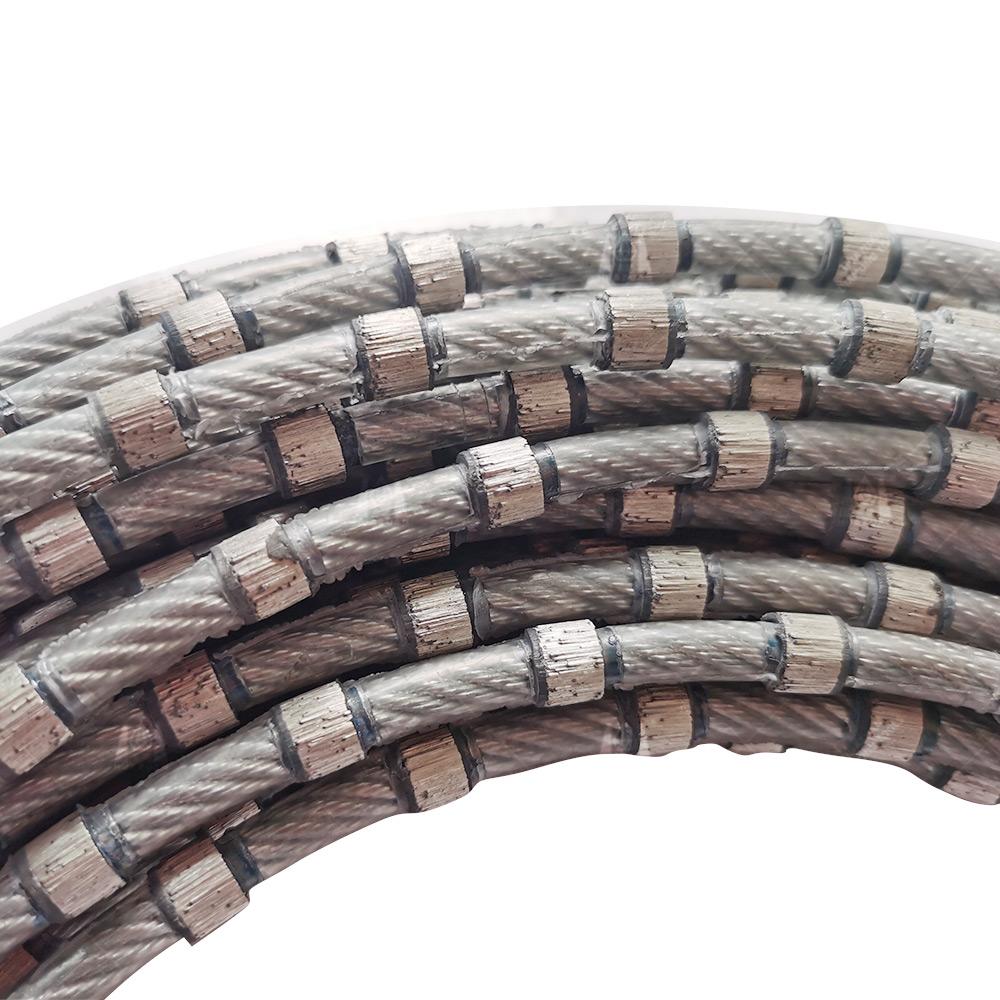 Close-up view of coiled Electroplated & Vacuum Brazed Diamond Wire Saw highlighting the diamond segments.