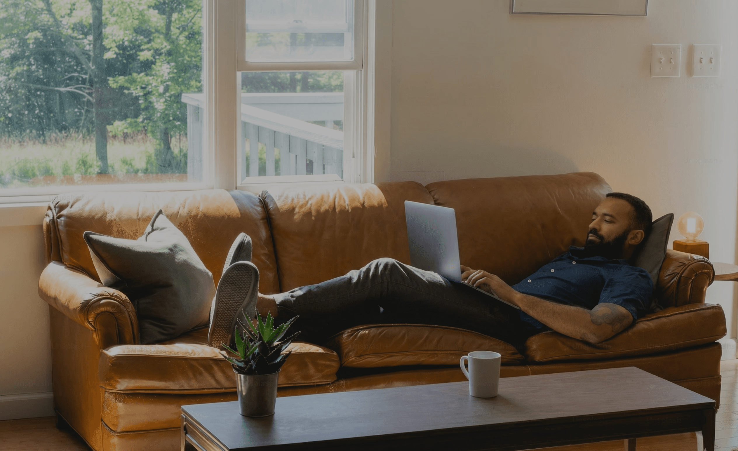 woman holding a phone and man looking at the phone. both are smiling