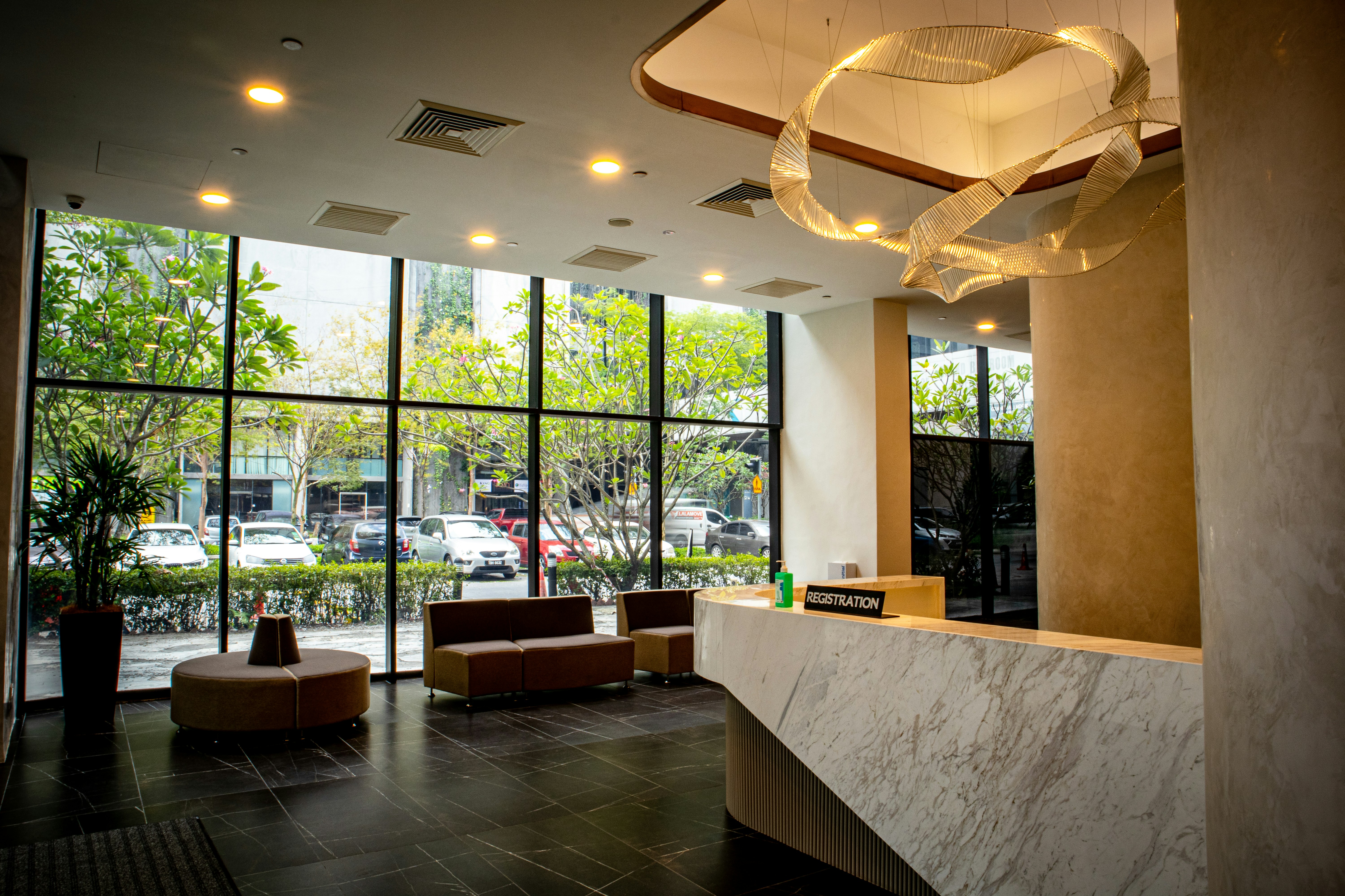 a lobby with a marble counter and a large window