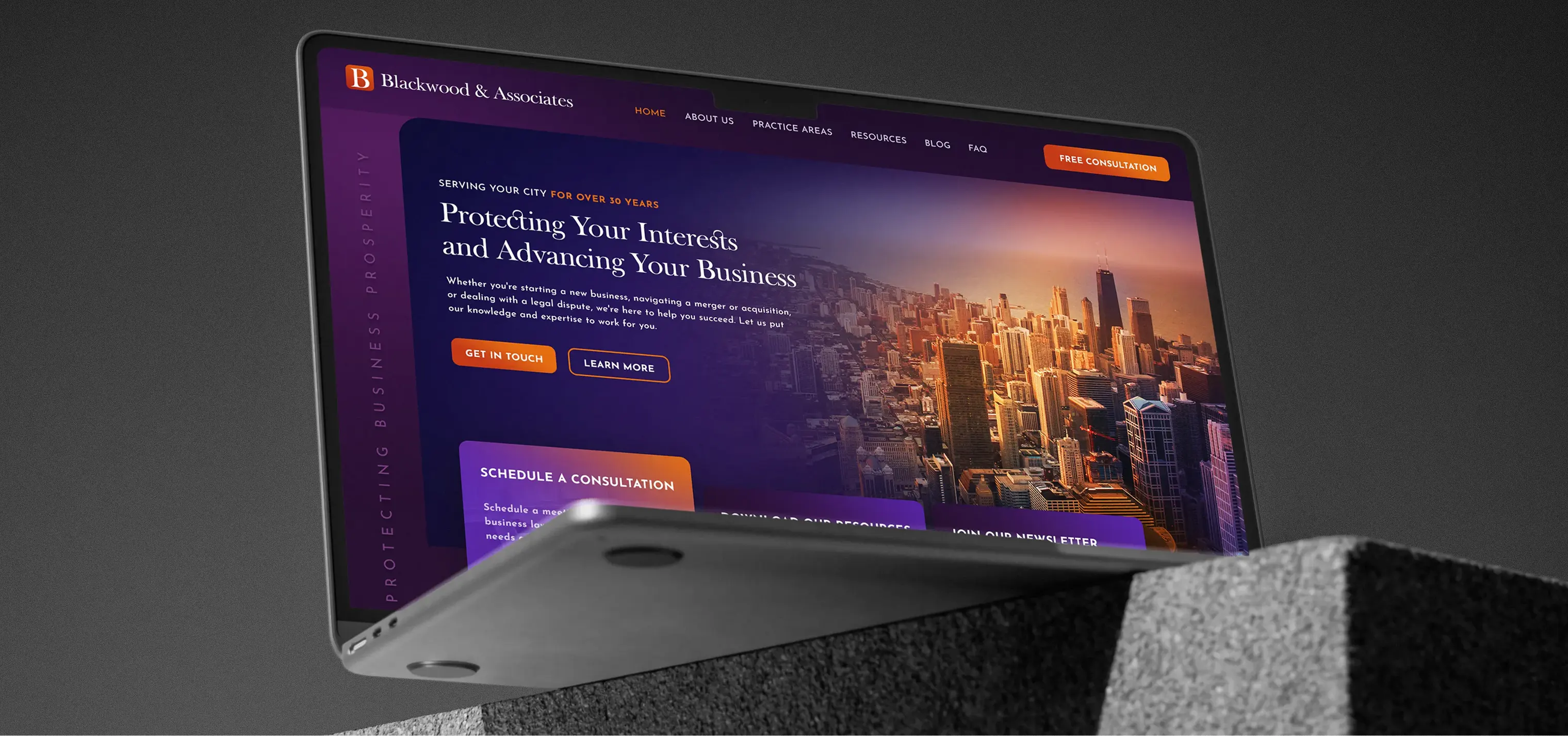 Website design for Blackwood & Associates displayed on a laptop — dark financial advisory site with city skyline imagery