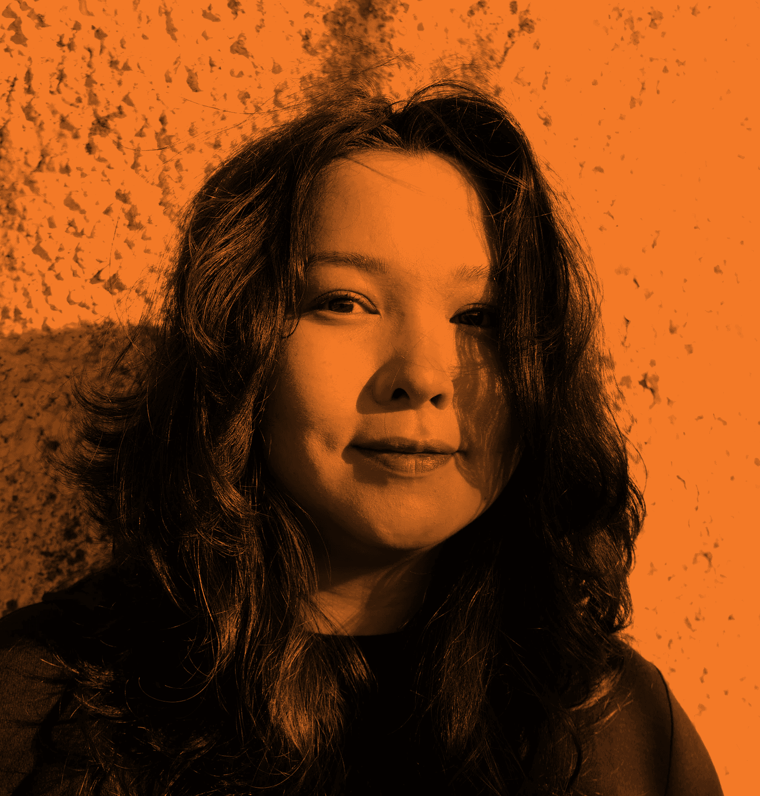 Woman with red hair covering mouth with hair