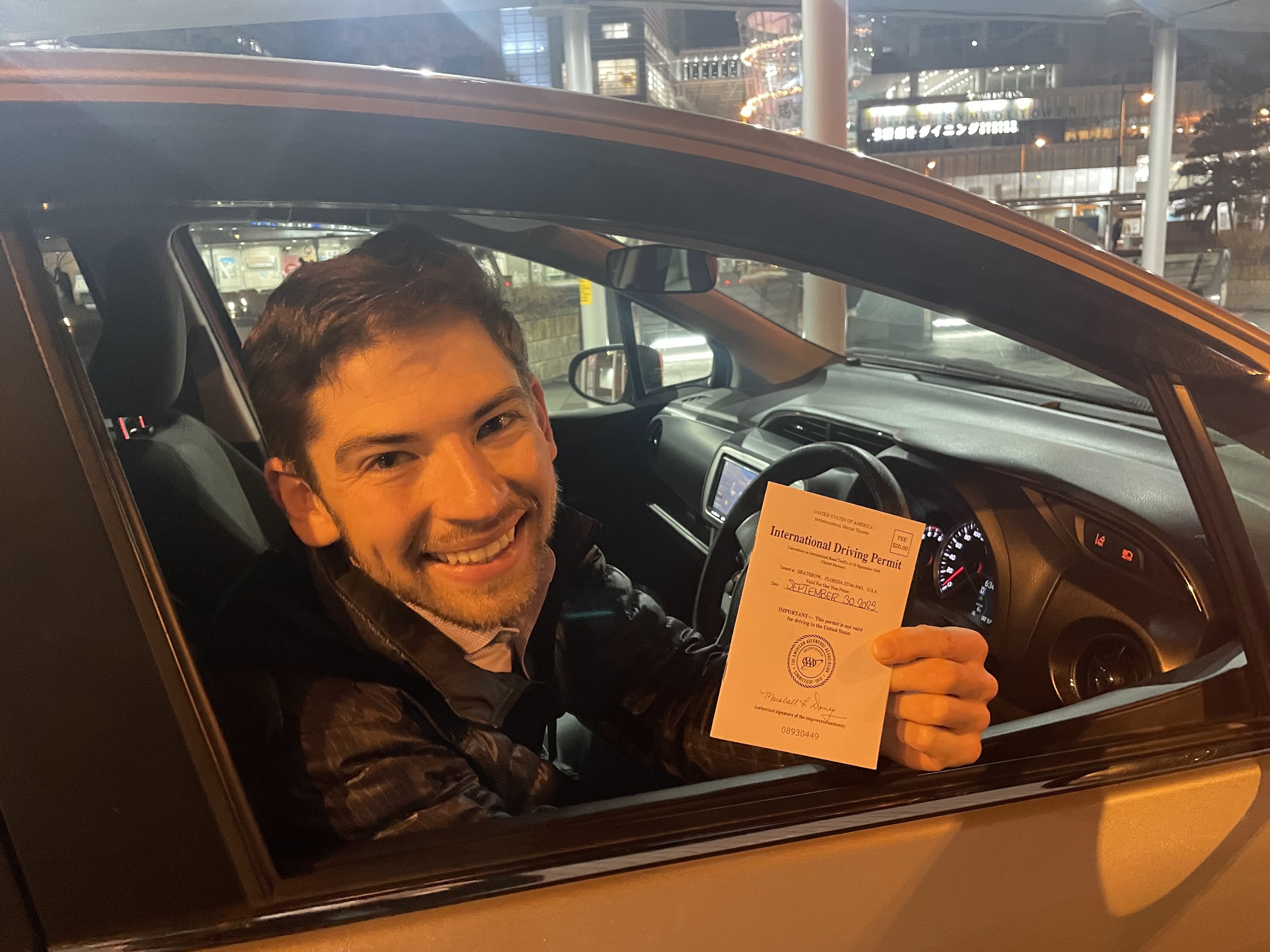 person holding iphone 6 inside car