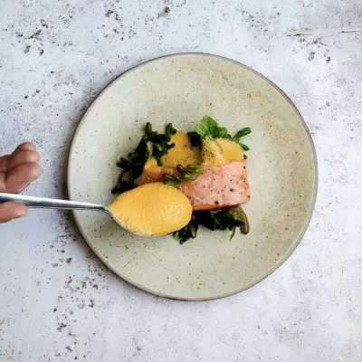 person holding stainless steel fork