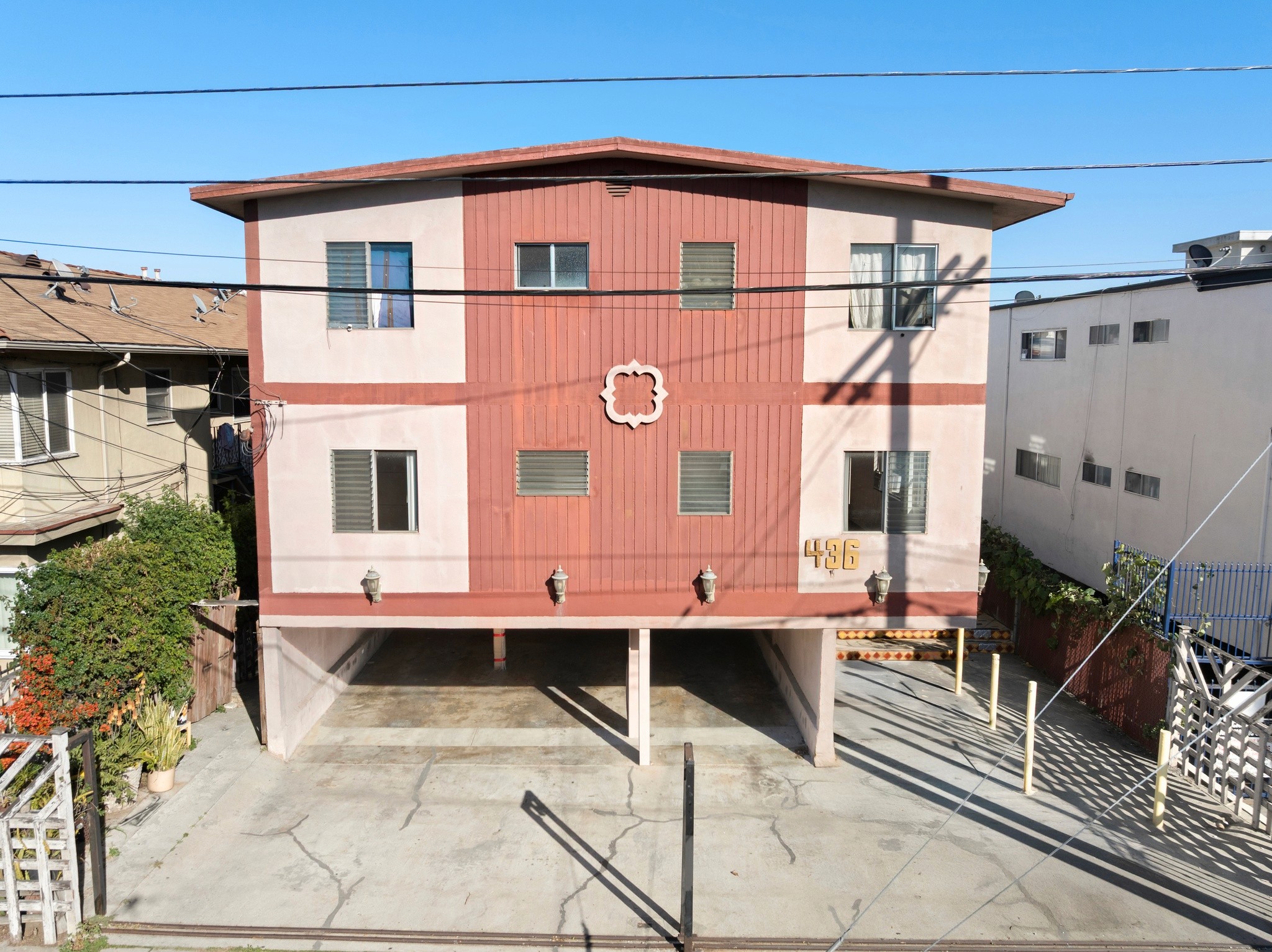 Elevated front view showing parking layout and building facade at 436 Normandie Pl.