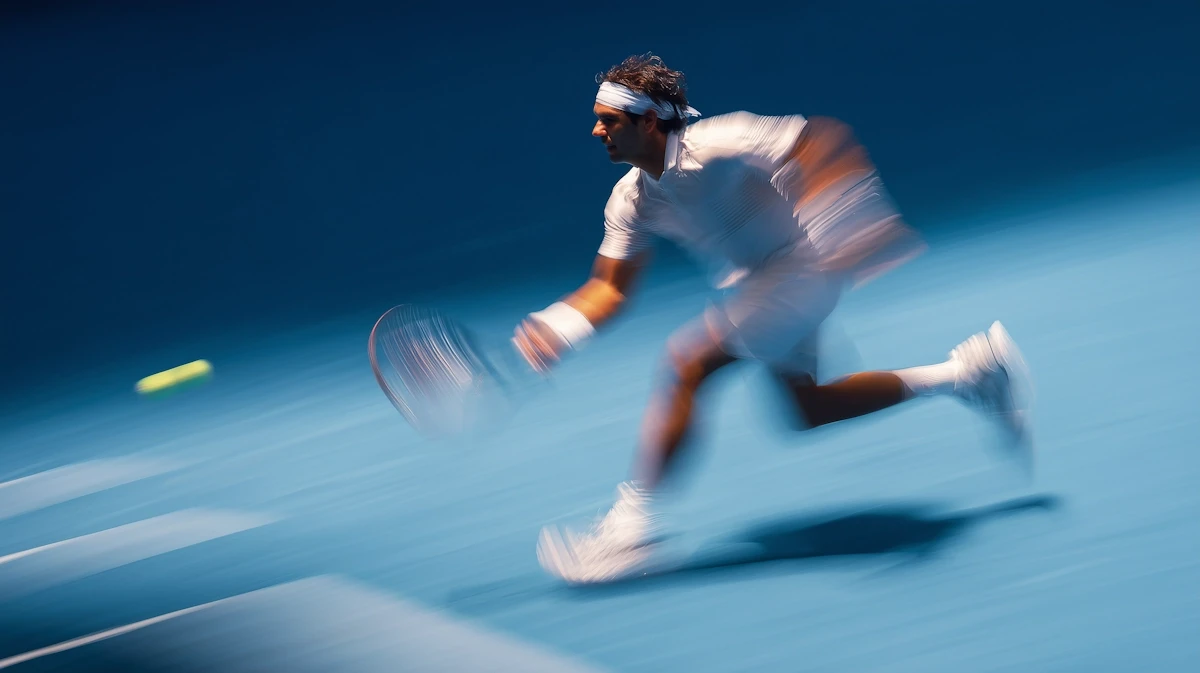 Modern skyscrapers viewed from below at night.