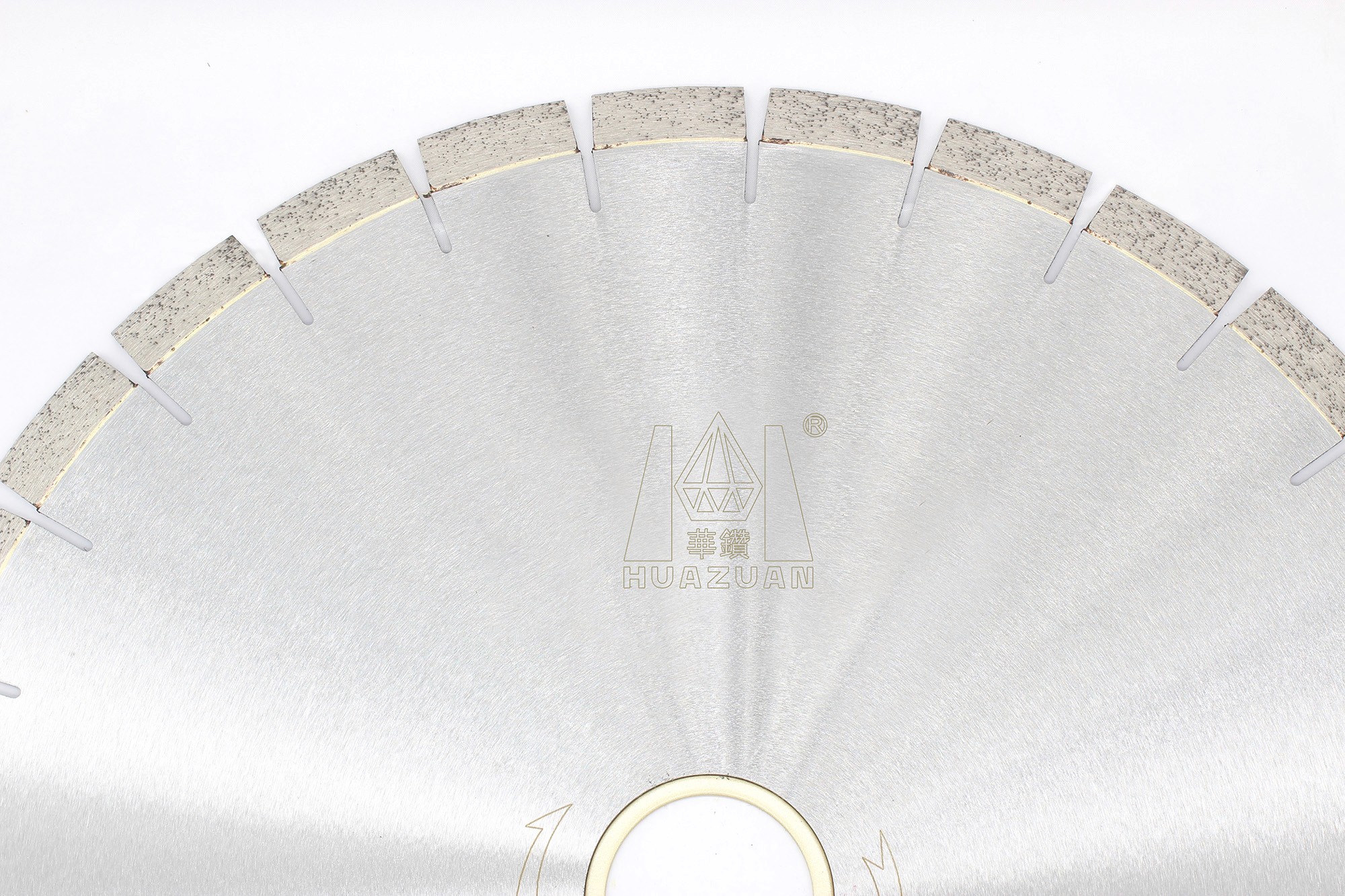 Close-up of the segmented edge on the diamond saw blade, designed for precise and clean cuts in granite.