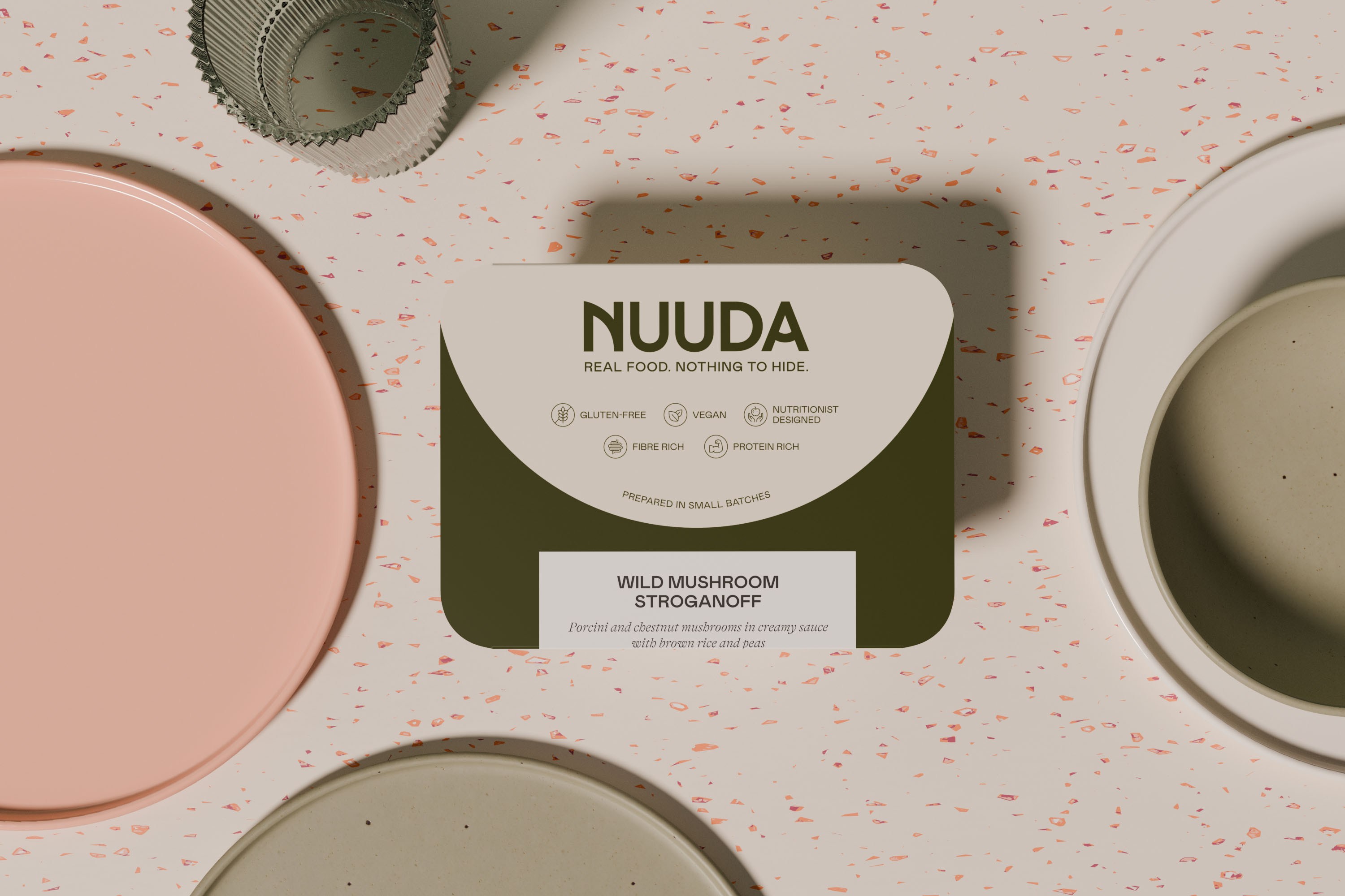 Nuuda meal sleeve for Wild Mushroom Stroganoff with dark green colour coding and custom dietary icons on a terrazzo surface