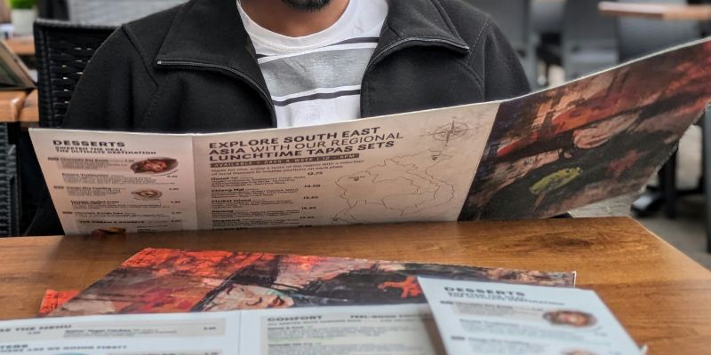 A man looking at a menu