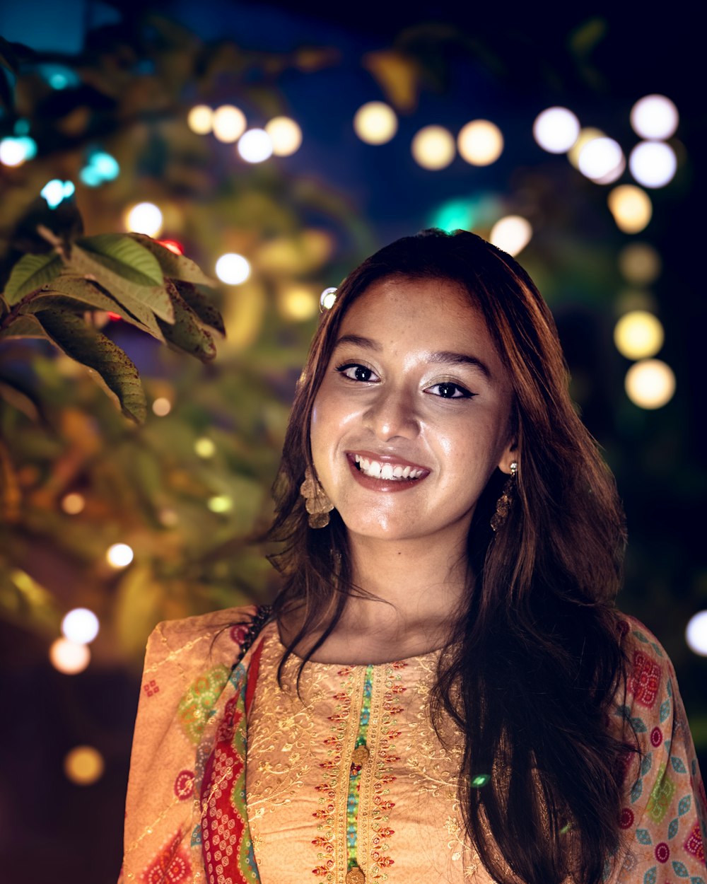 Lena Okafor, independent brand designer, smiling in the evening
