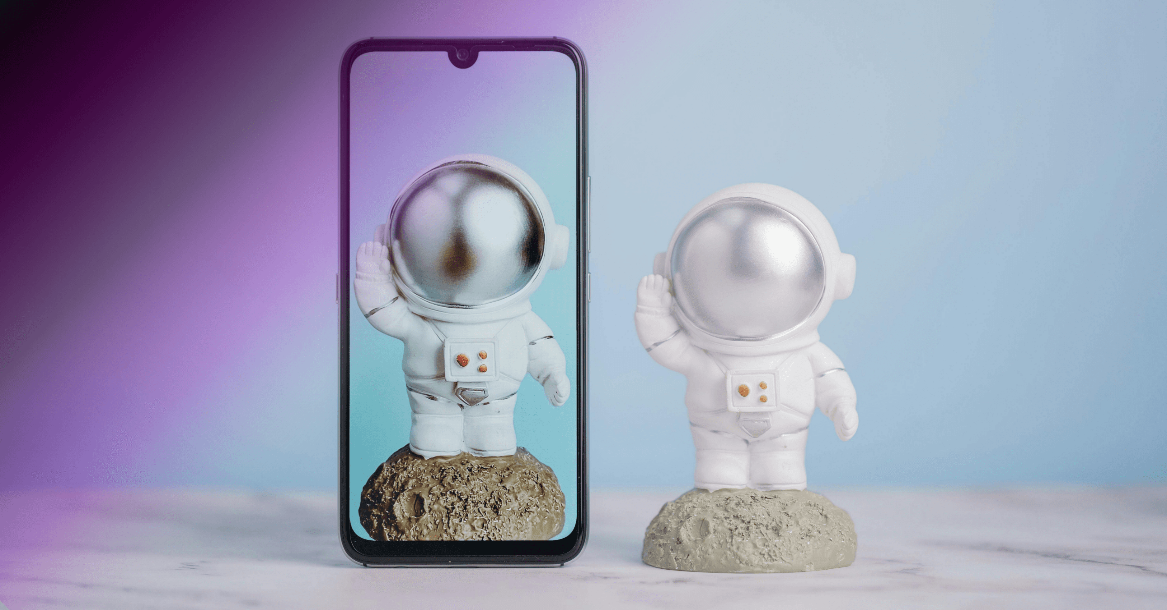 Two identical astronaut figures representing code duplication in a digital and physical space.