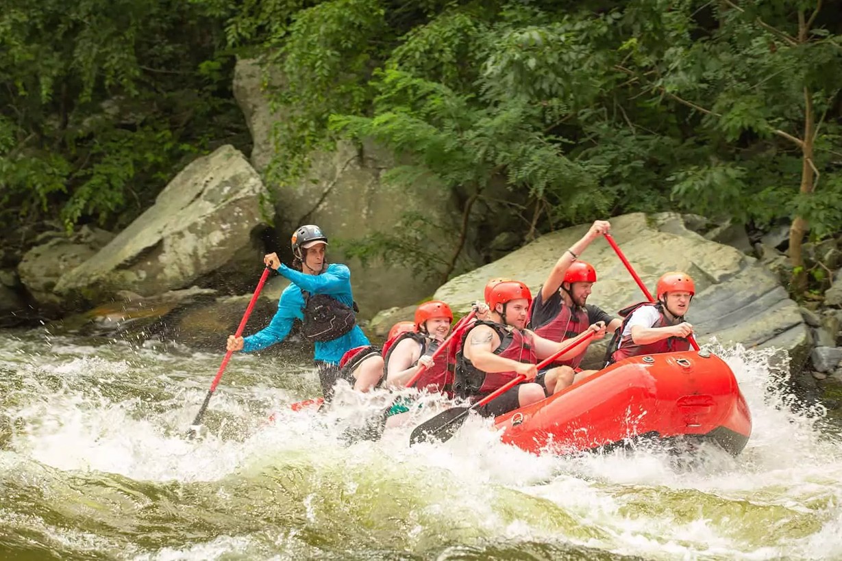 Rafters laughing as they safely make it through rapids
