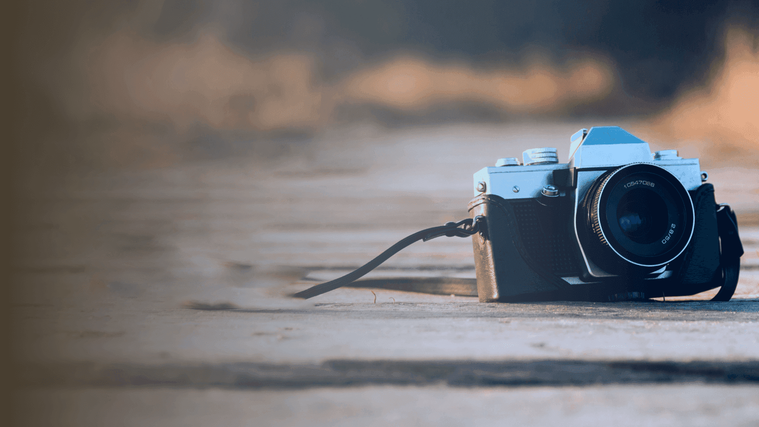 A vintage camera resting on a sunlit pathway, symbolizing the art and excellence celebrated in the world’s best photography from the Sony Awards 2023.