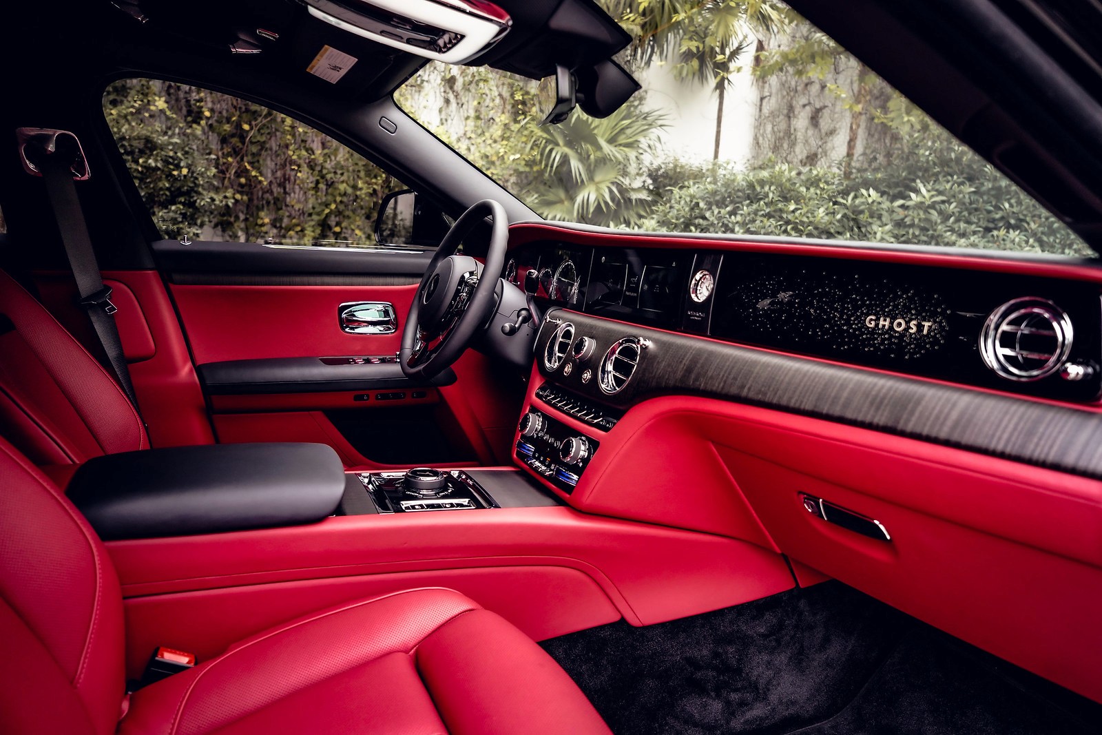 Interior shot from the passenger side, showcasing the front seating area and steering wheel. Right Side Profile of Rolls-Royce Ghost: Perfect side profile highlighting the Ghost's elegant lines and black exterior from the right side.