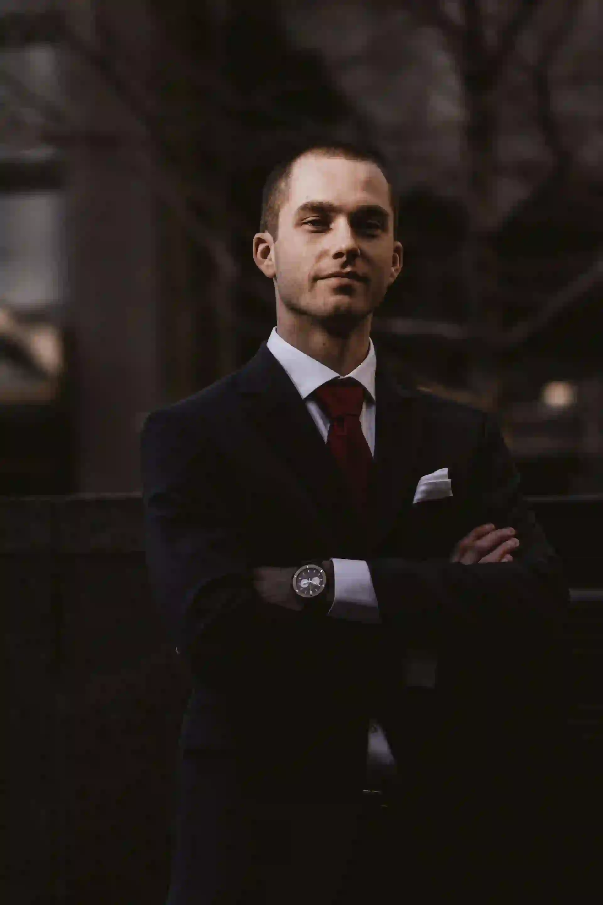 man in black blazer smiling
