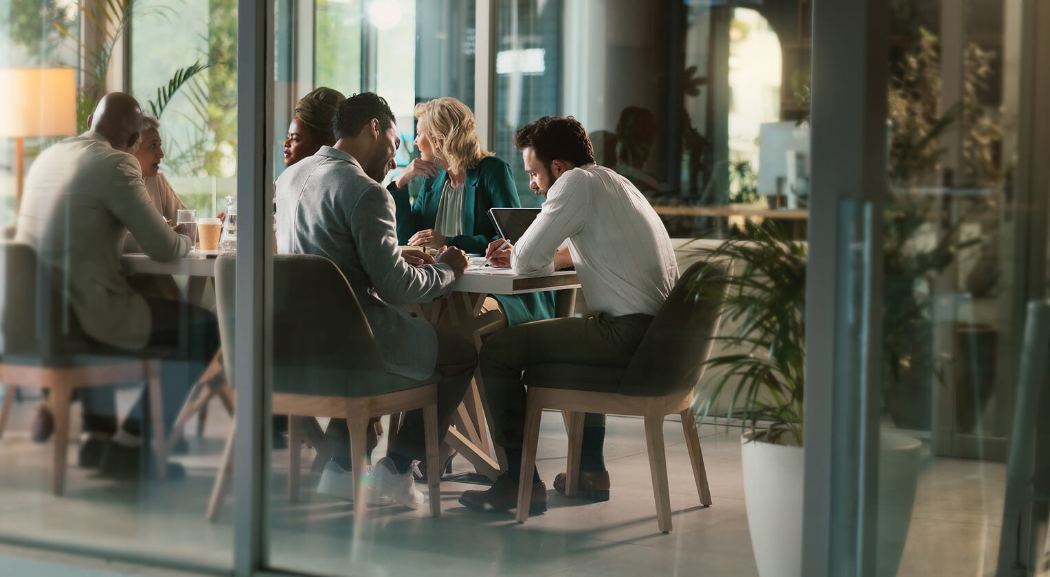 A group of professionals in a conference room
