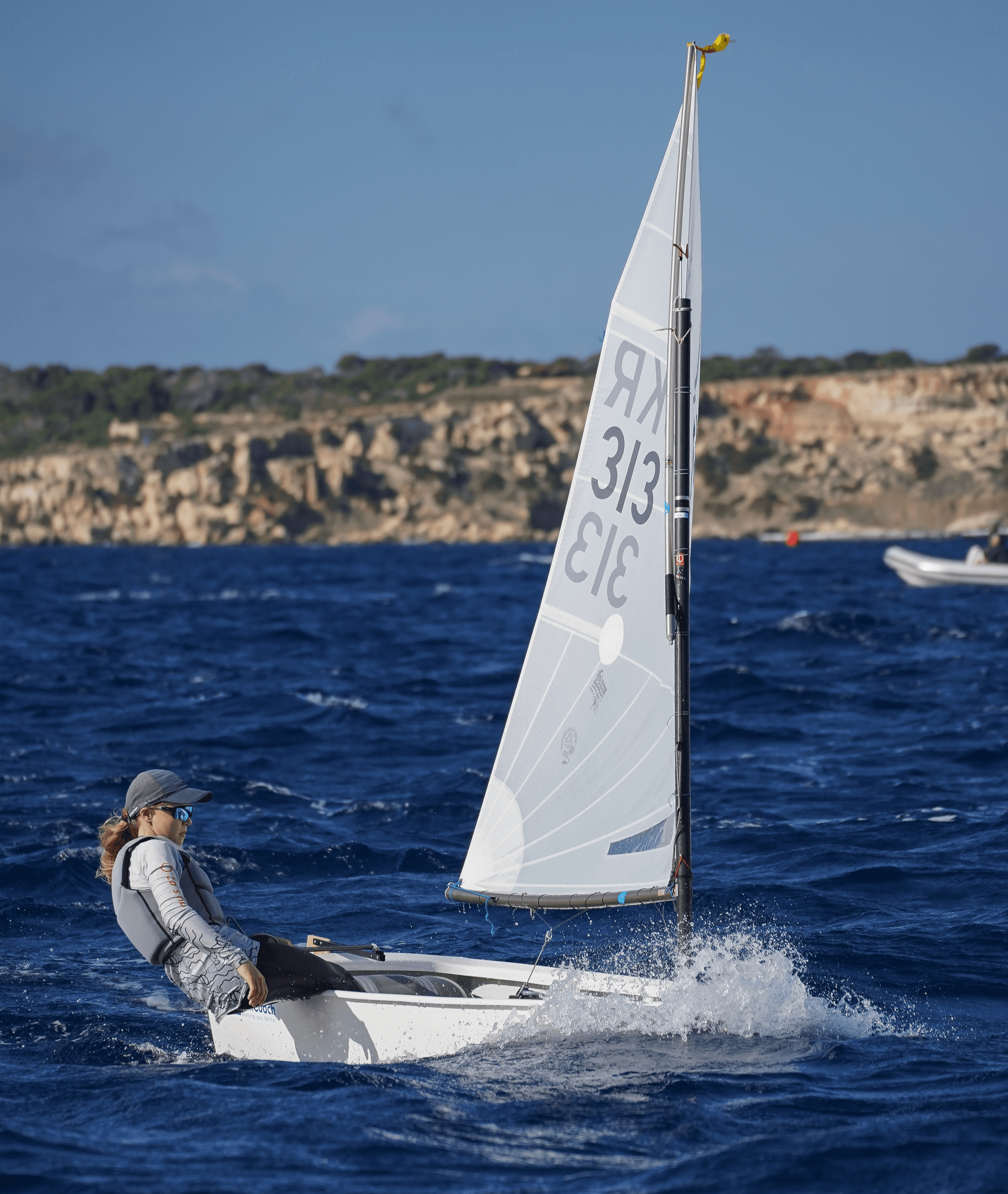 A man stading with Surfboard