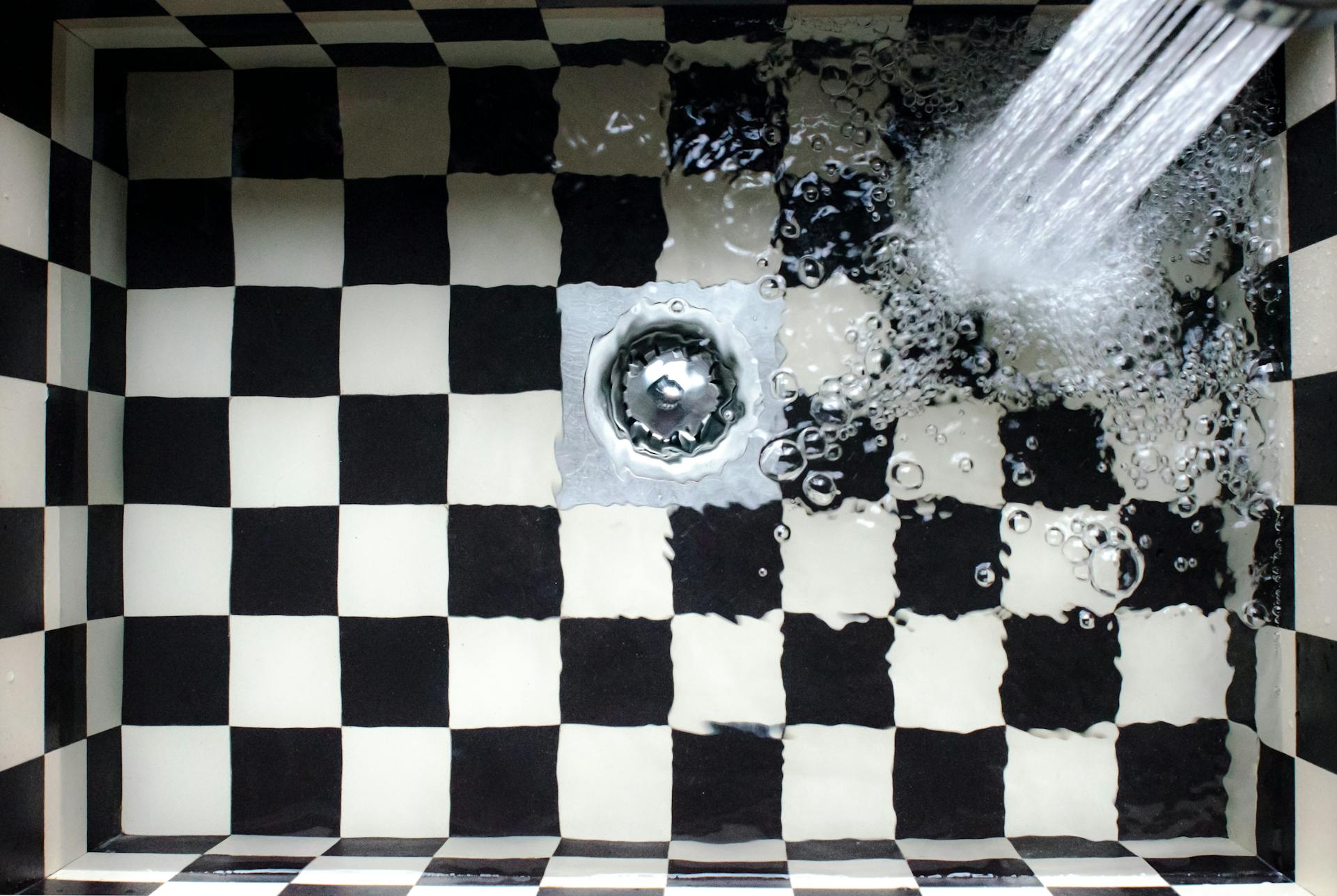 Picture of a clogged drain. How much does drain cleaning cost? Learn why professional drain cleaning is worth it.