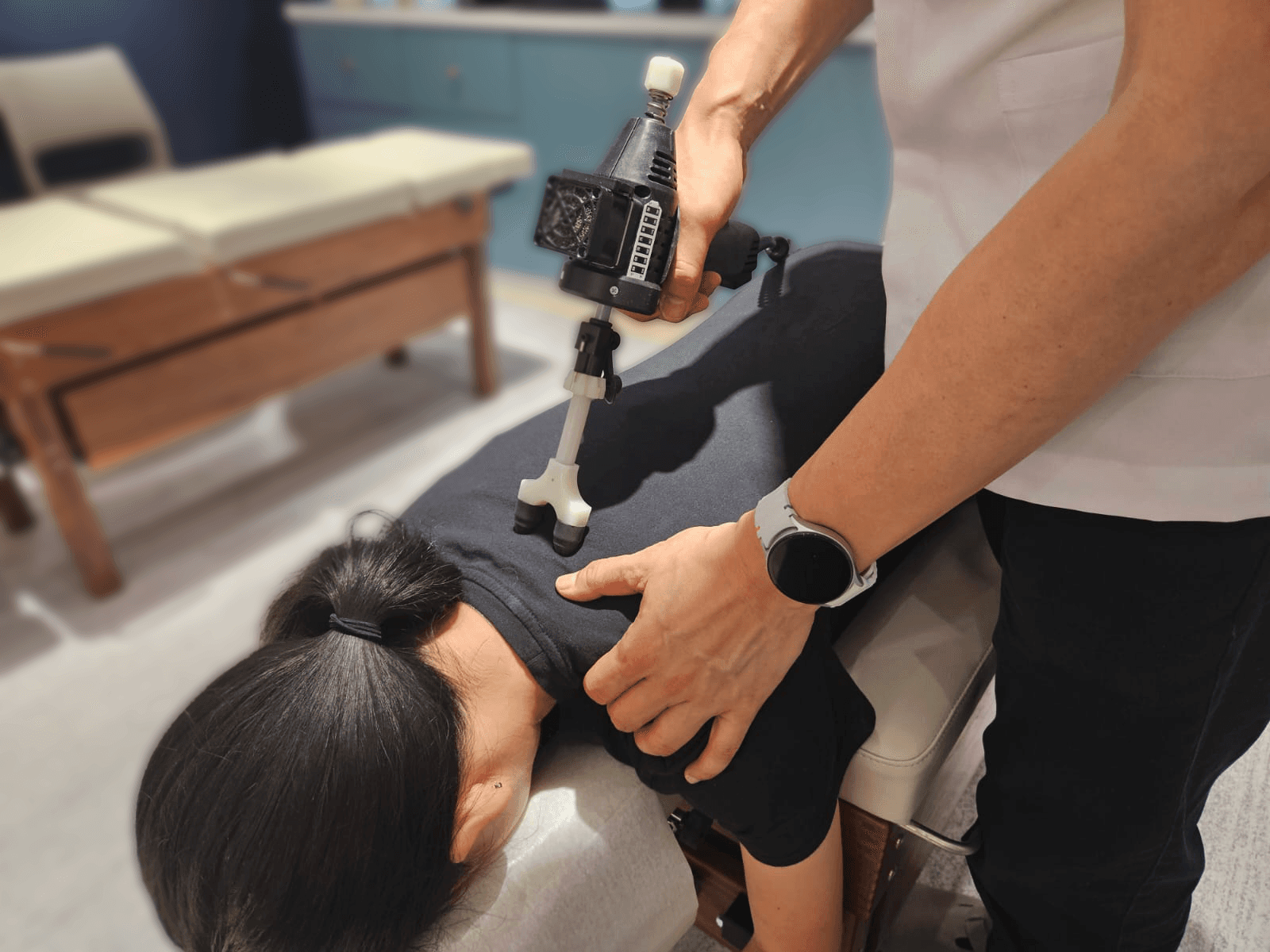 Instrument-assisted chiropractic treatment at United Chiropractic Center