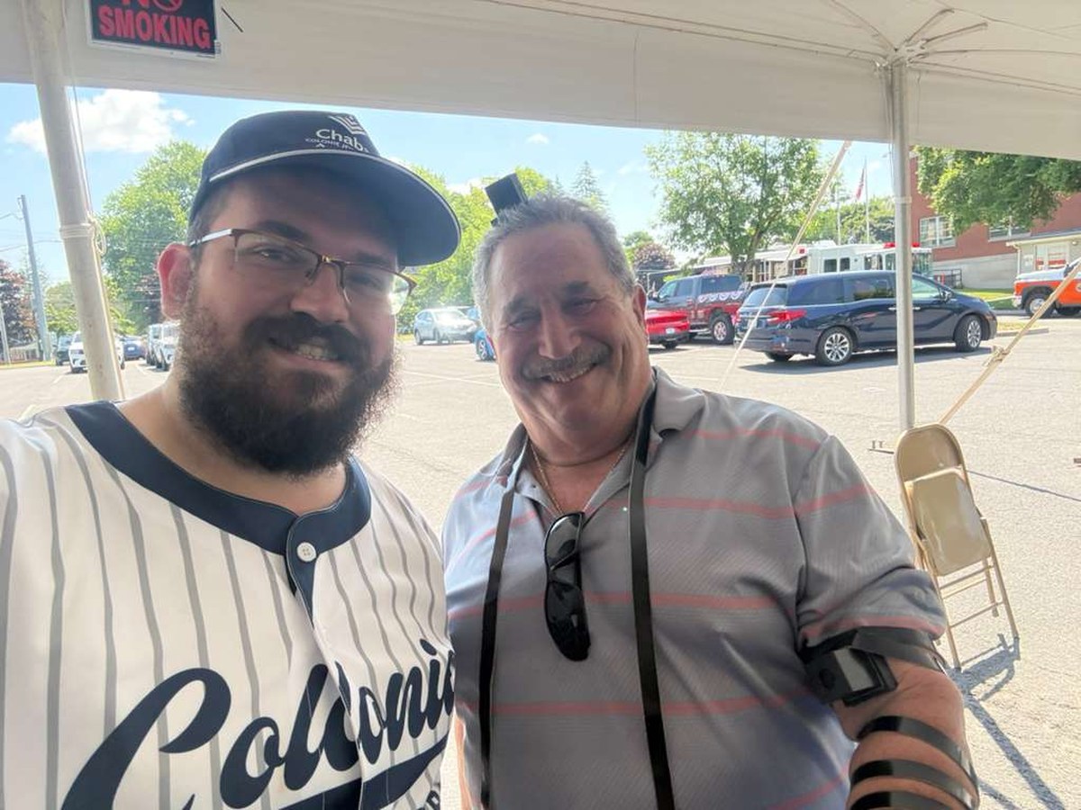 Laying tefillin at the Colonie Chabad booth during Colonie’s USA 250 celebration.