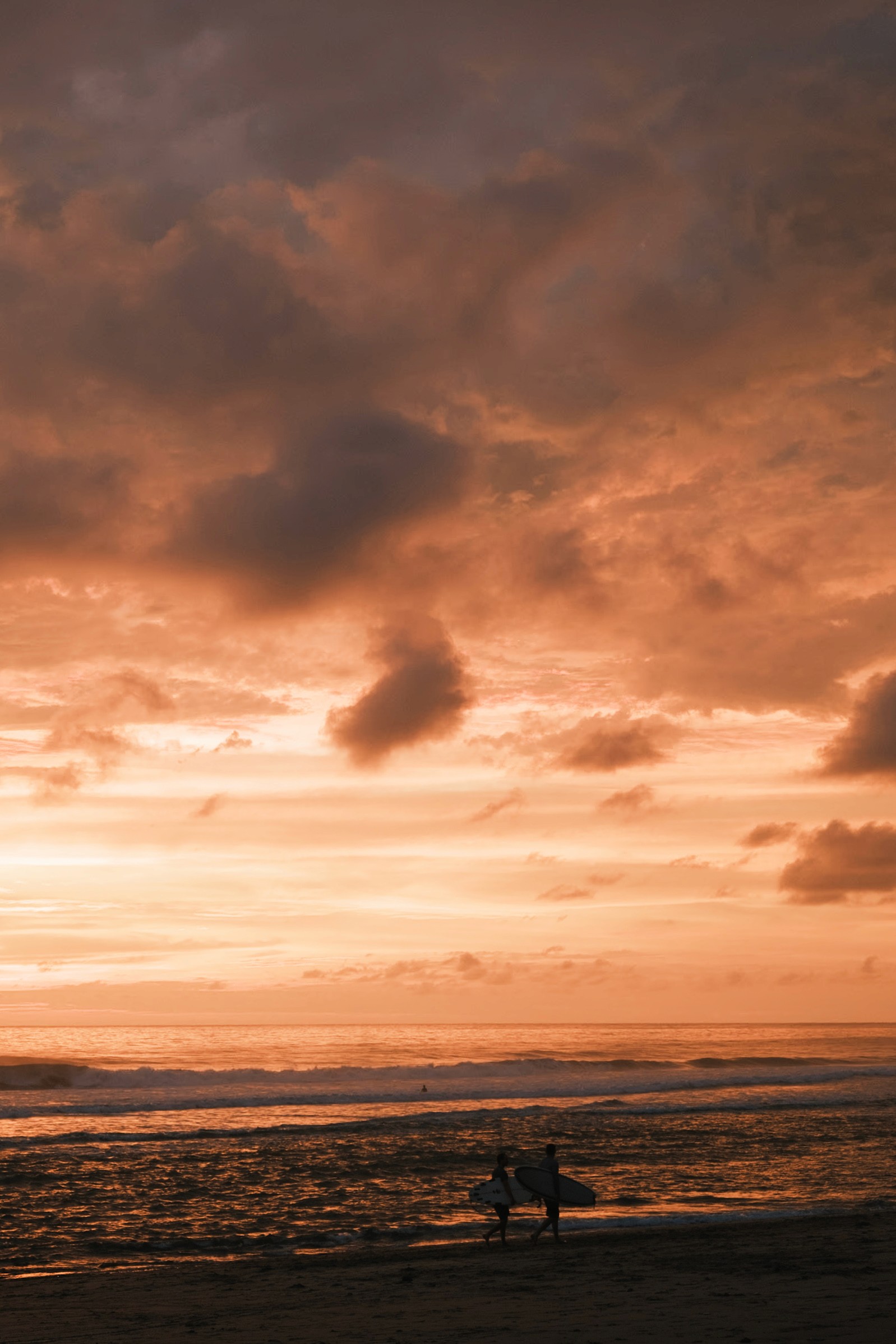 A man with surfboard at beach