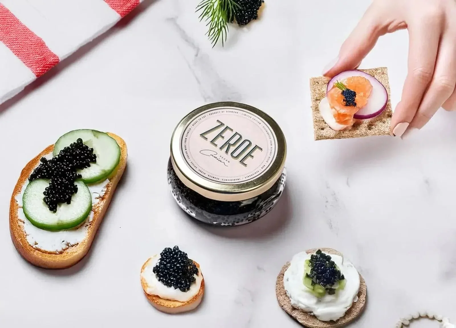 Zeroe caviar with blinis and garnish