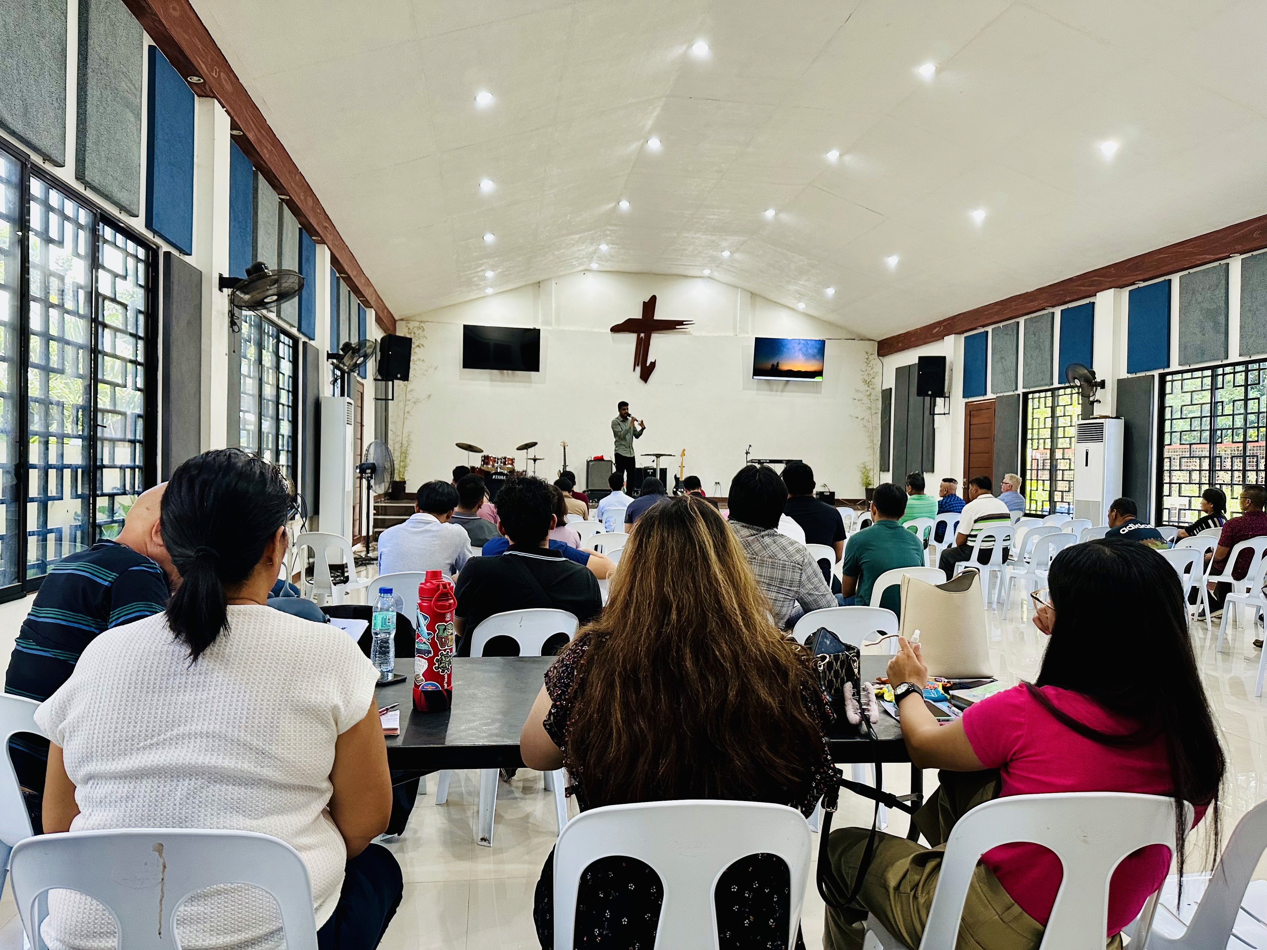 a statue of jesus on the cross in a church