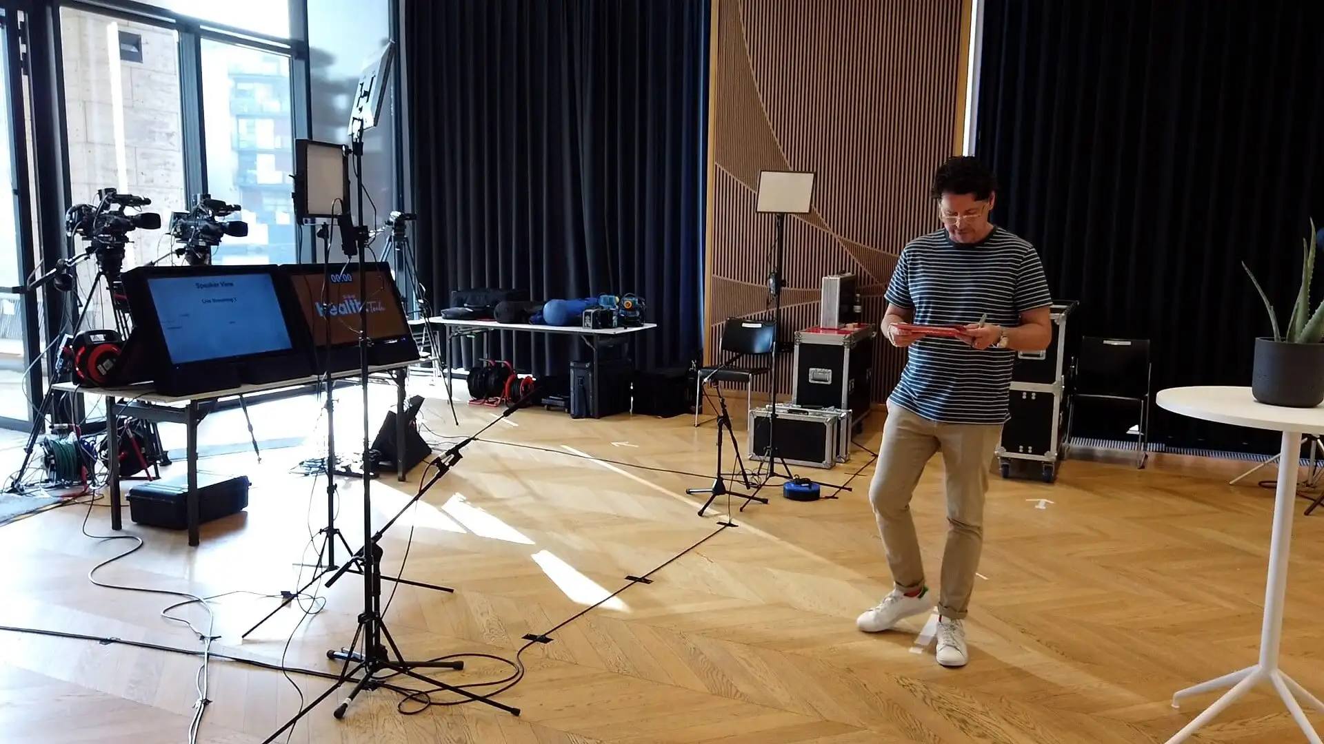 Event crew preparing cameras, lighting, and audio equipment for a live WIRED Health Tech broadcast.