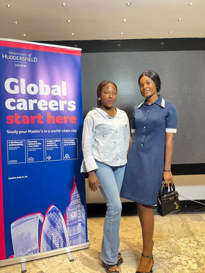 woman in white and red dress standing on green grass field during daytime