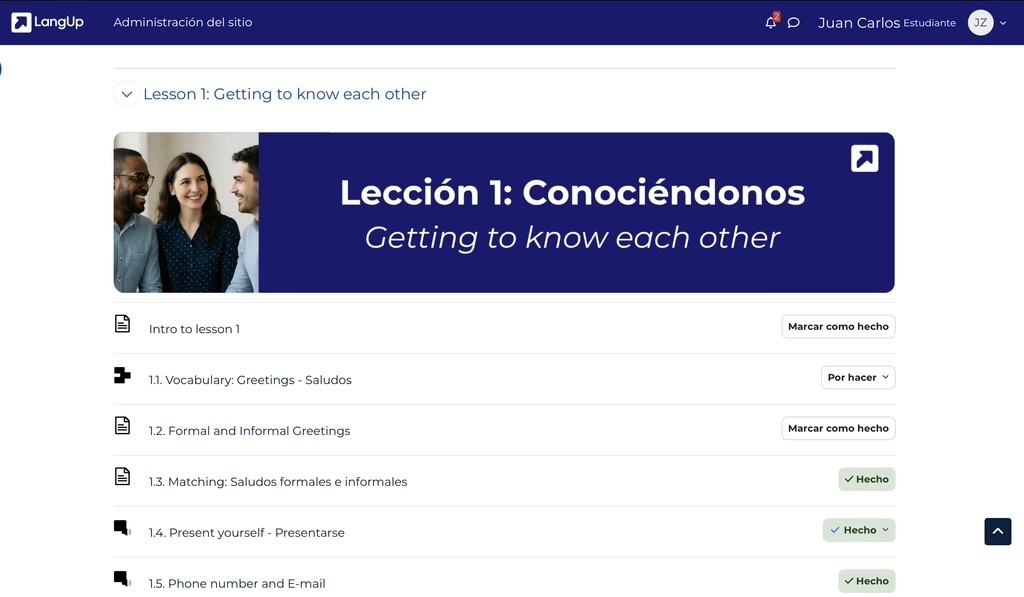 Man in plaid shirt using smartphone at desk