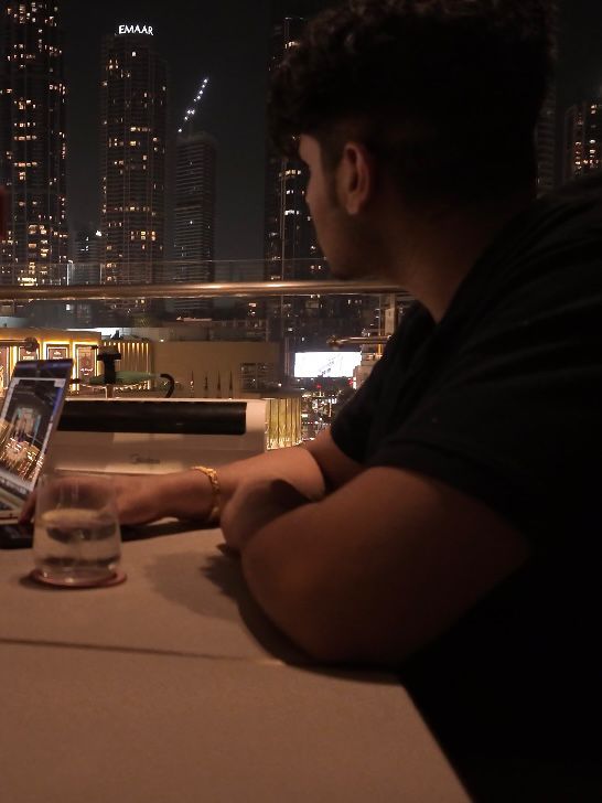 a blurry photo of a person standing in front of a wall