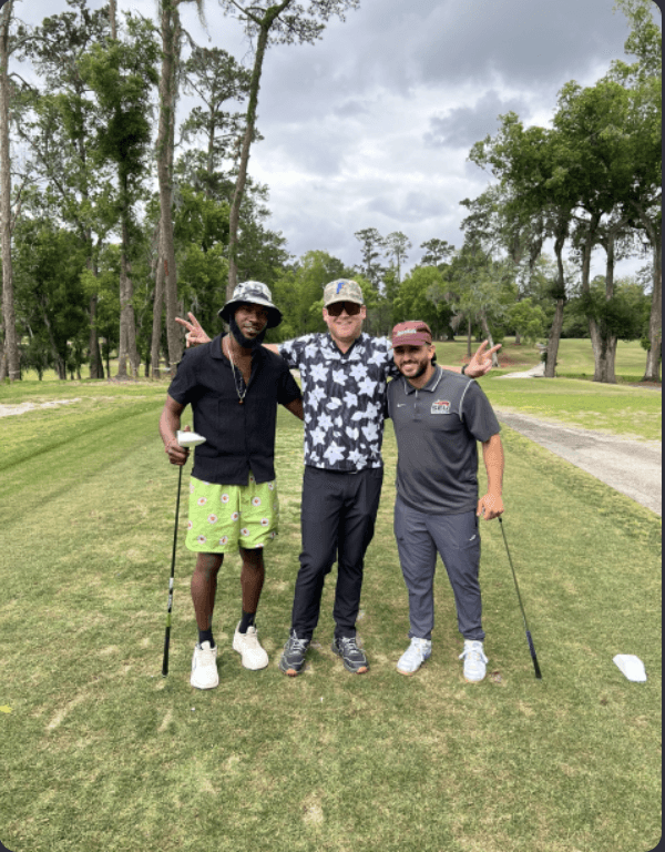 An image of the owner of FlipFlip golfing with some of the most experienced members