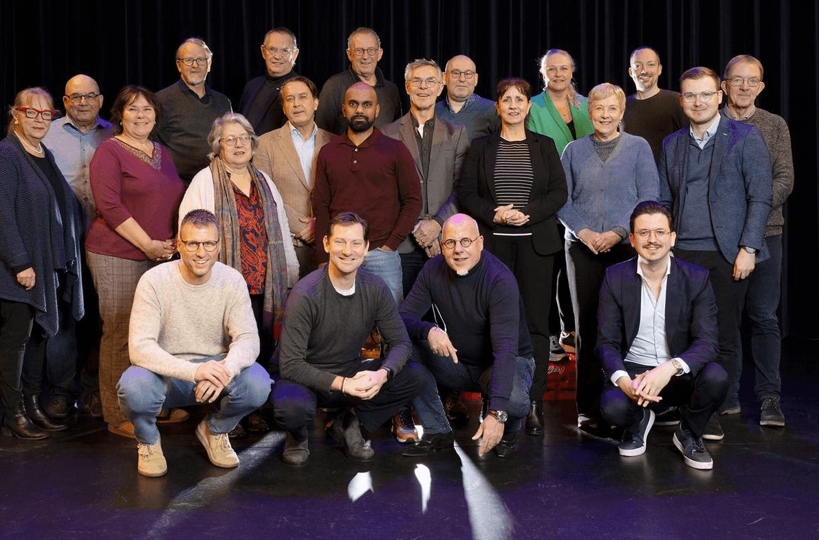 person sitting on grass and using phone