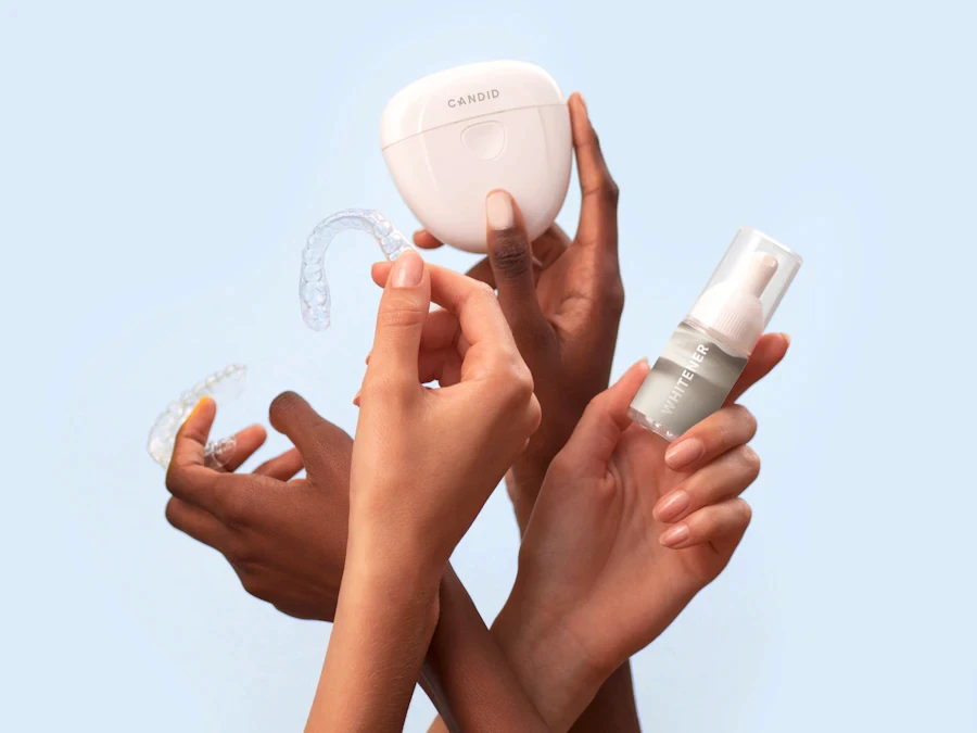 Hand holding a clear aligner