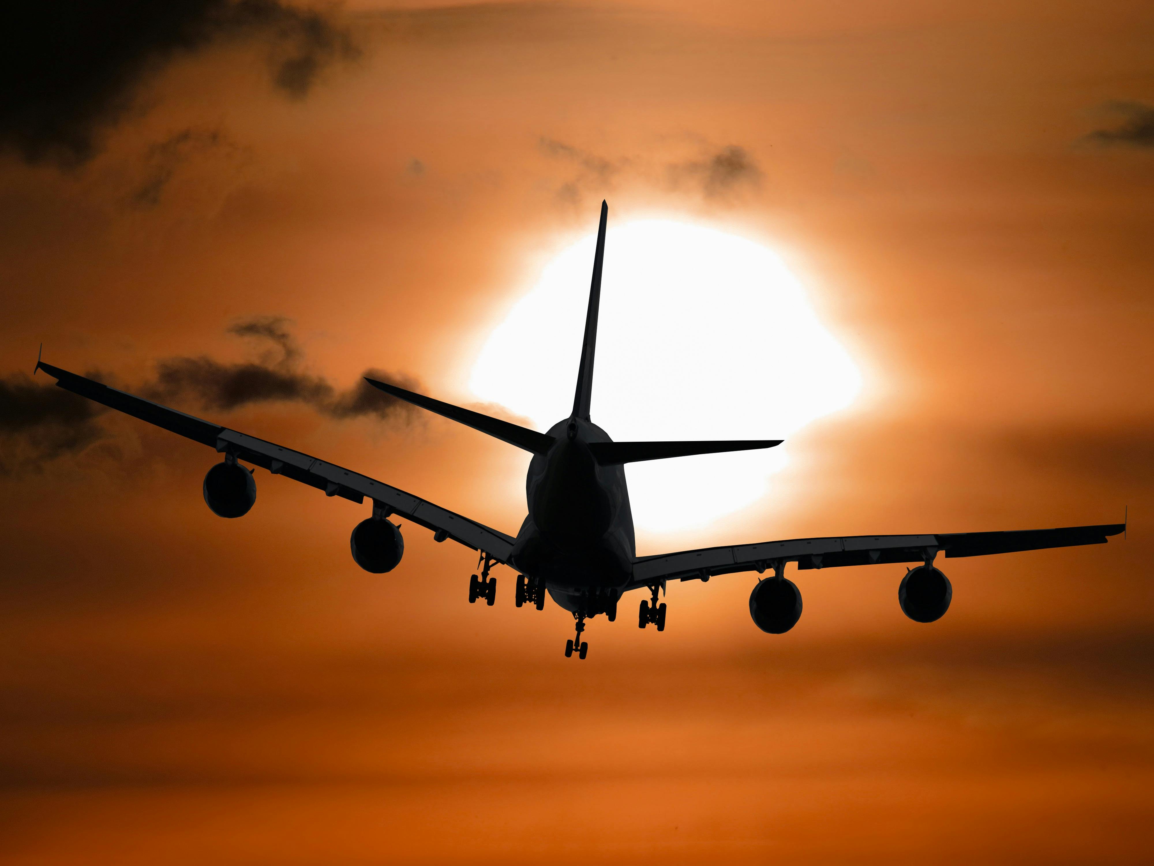 Airplane flying at dusk