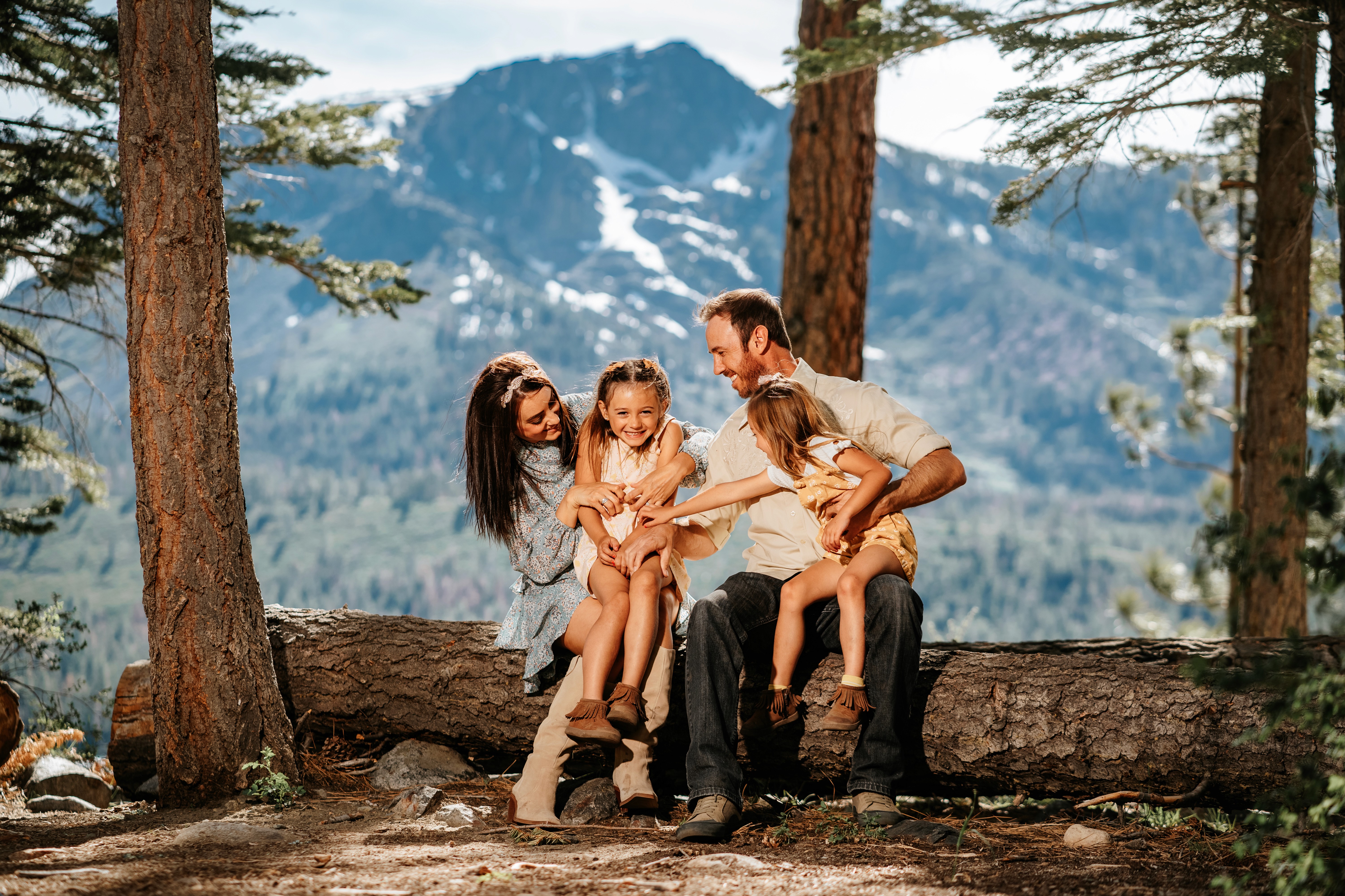 A couple stands outdoors at sunset.