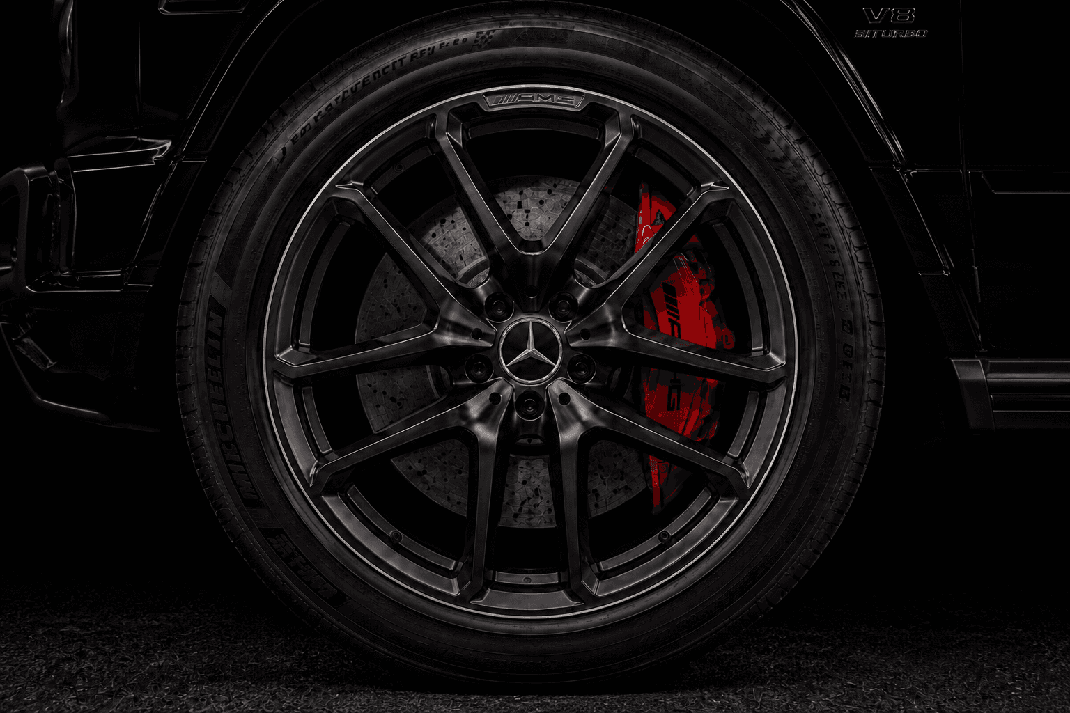 Mercedes-AMG G 63 black wheel with red brake caliper engineering detail