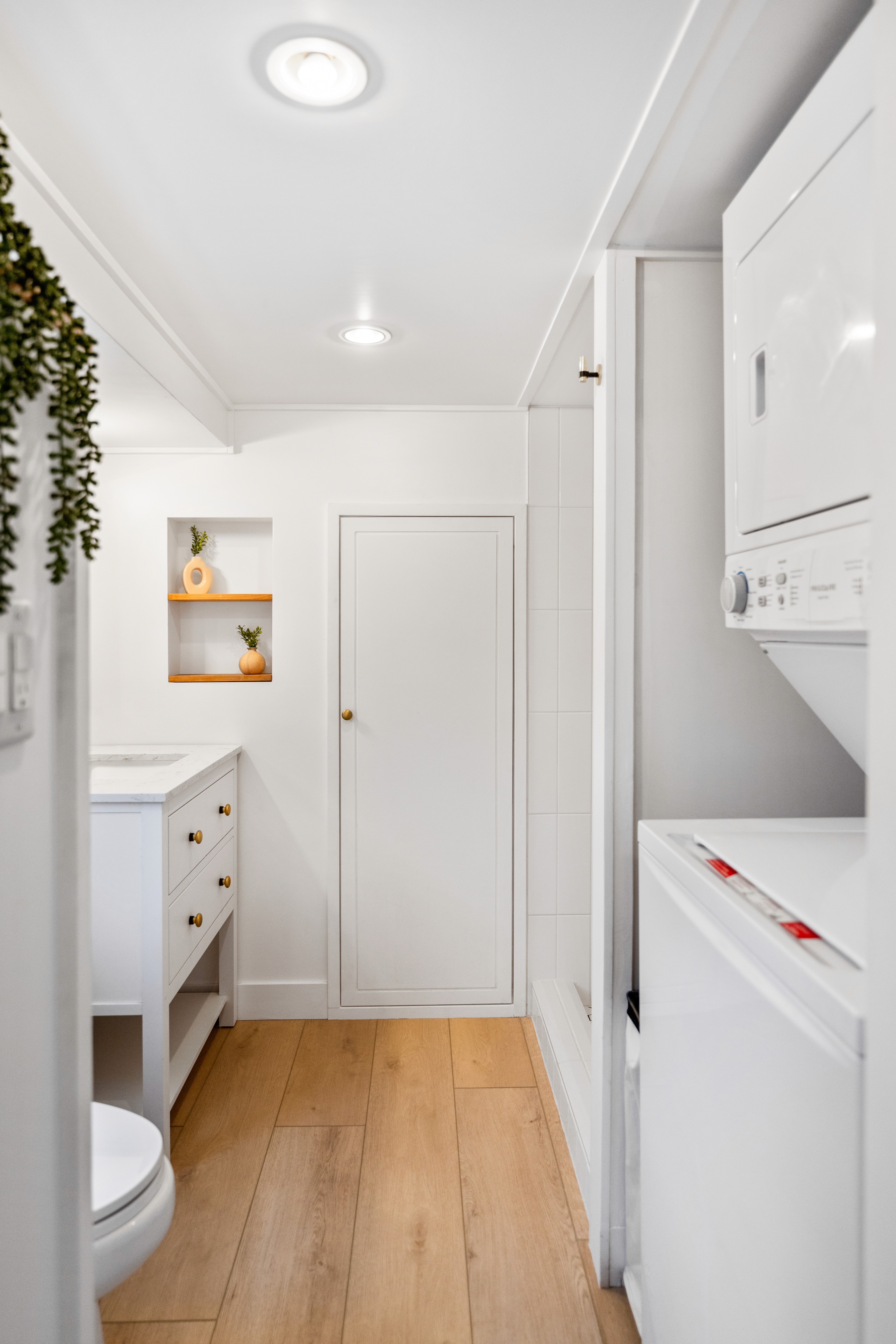 Retro-style kitchen in Southern Utah featuring green cabinets and wood hood above oven