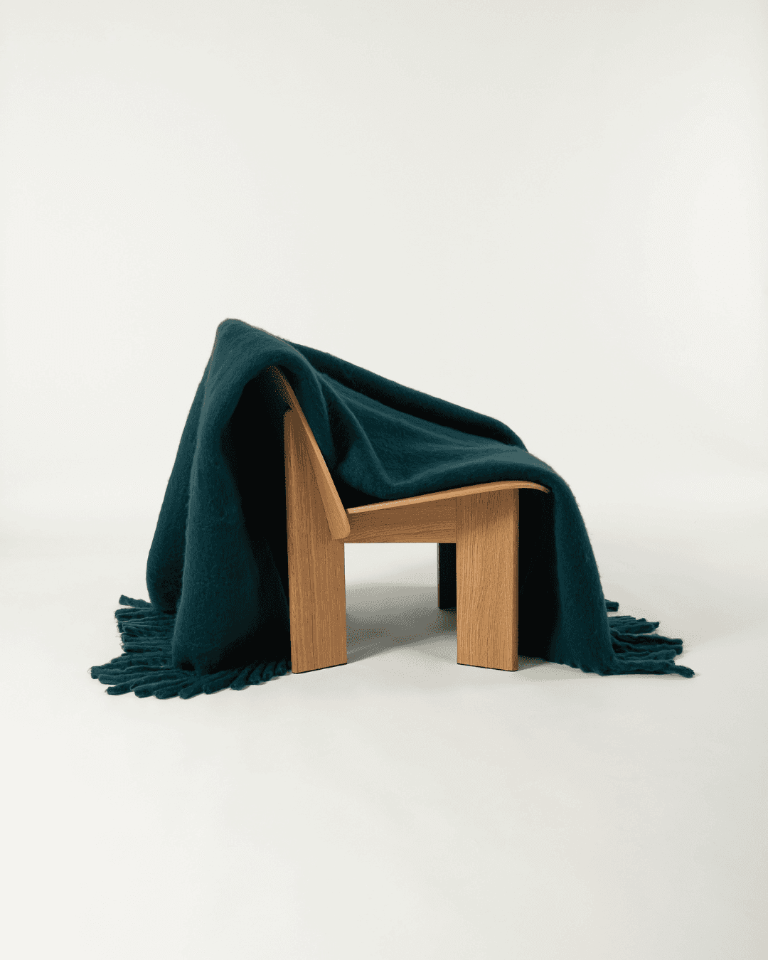 Faux mohair blanket in alpine draped over wooden chair