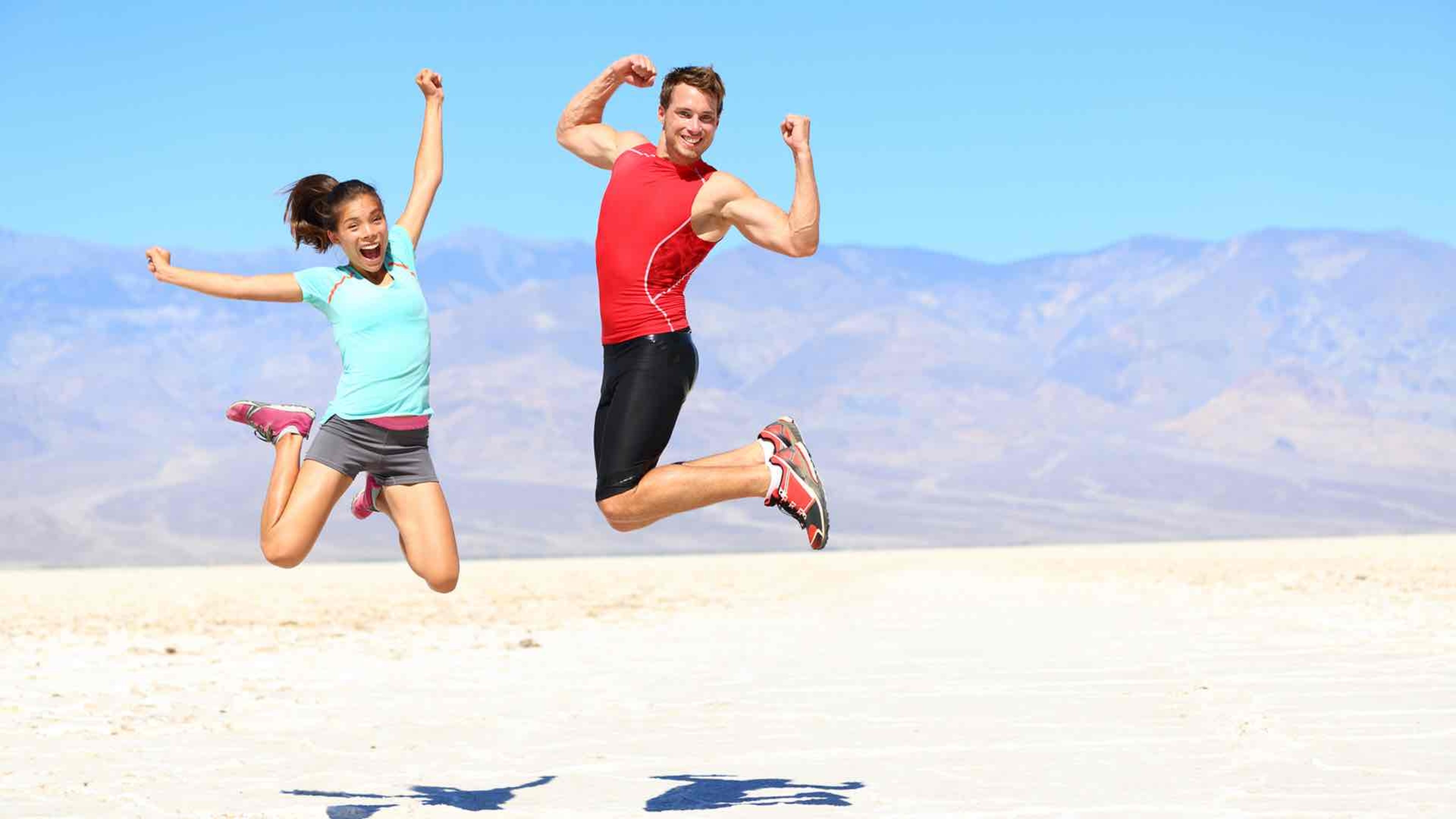 man and woman doing jumpshot