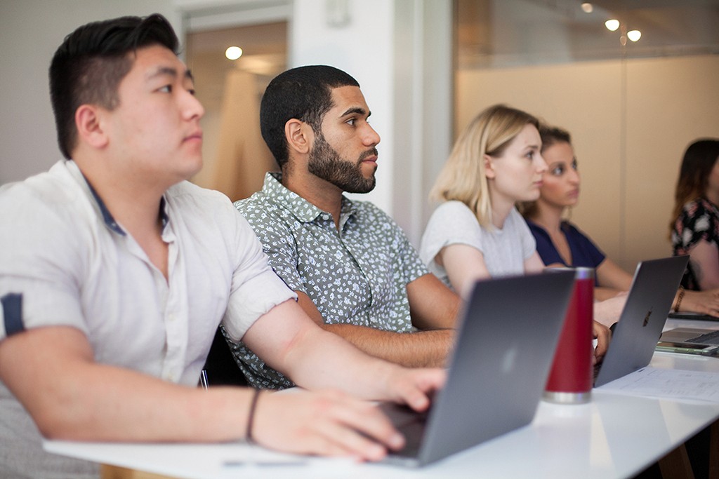 A candid mid-session moment capturing the energy of active, applied design learning.