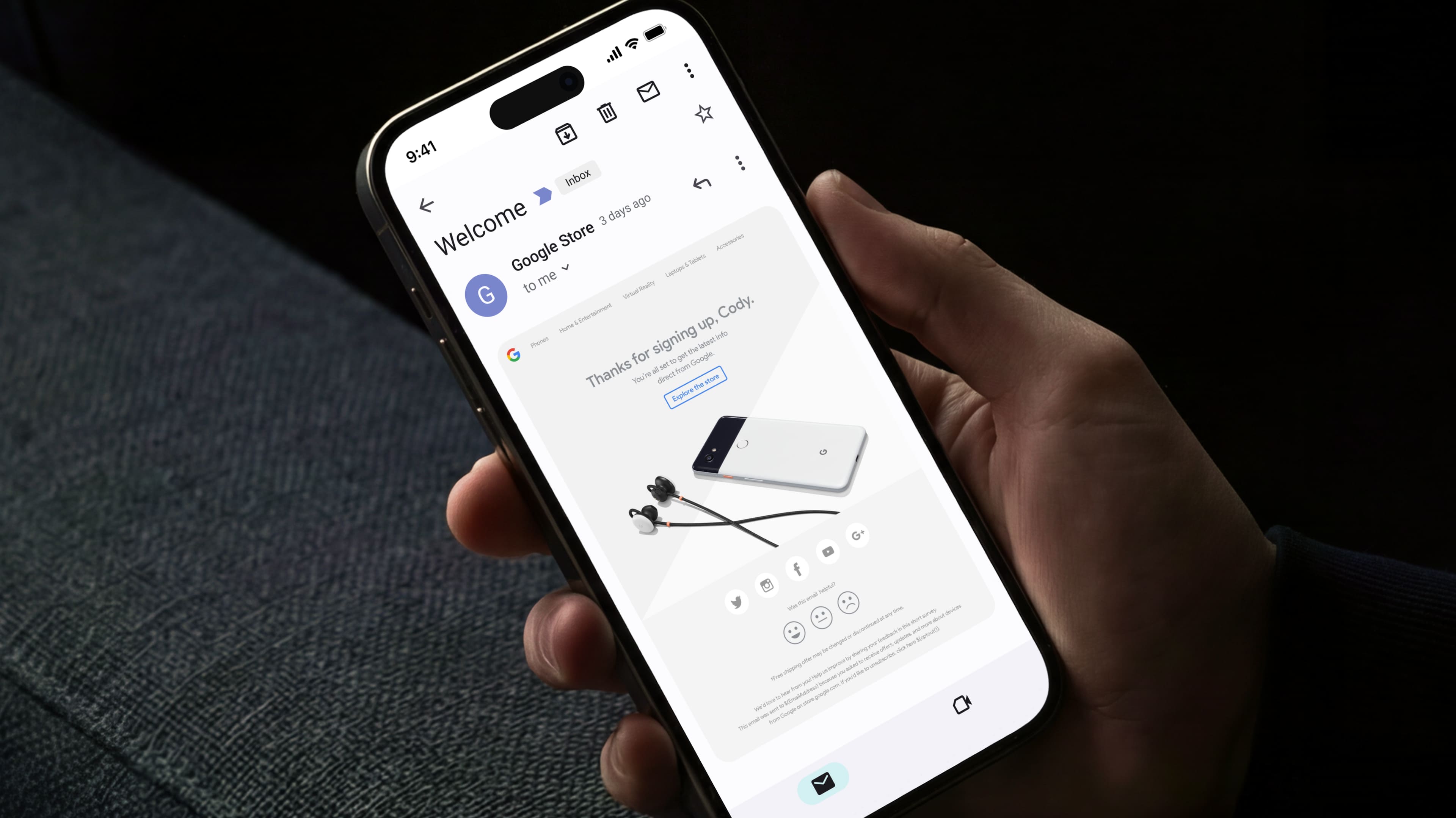 Google store welcome email on an iphone held by a hand over a sofa