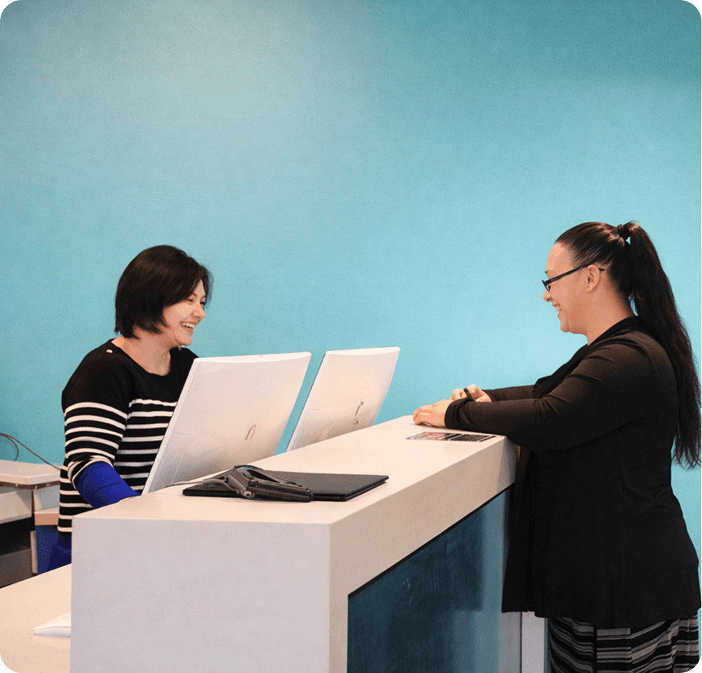 Credit union staff using CU*NorthWest CBX core banking software at their workstation