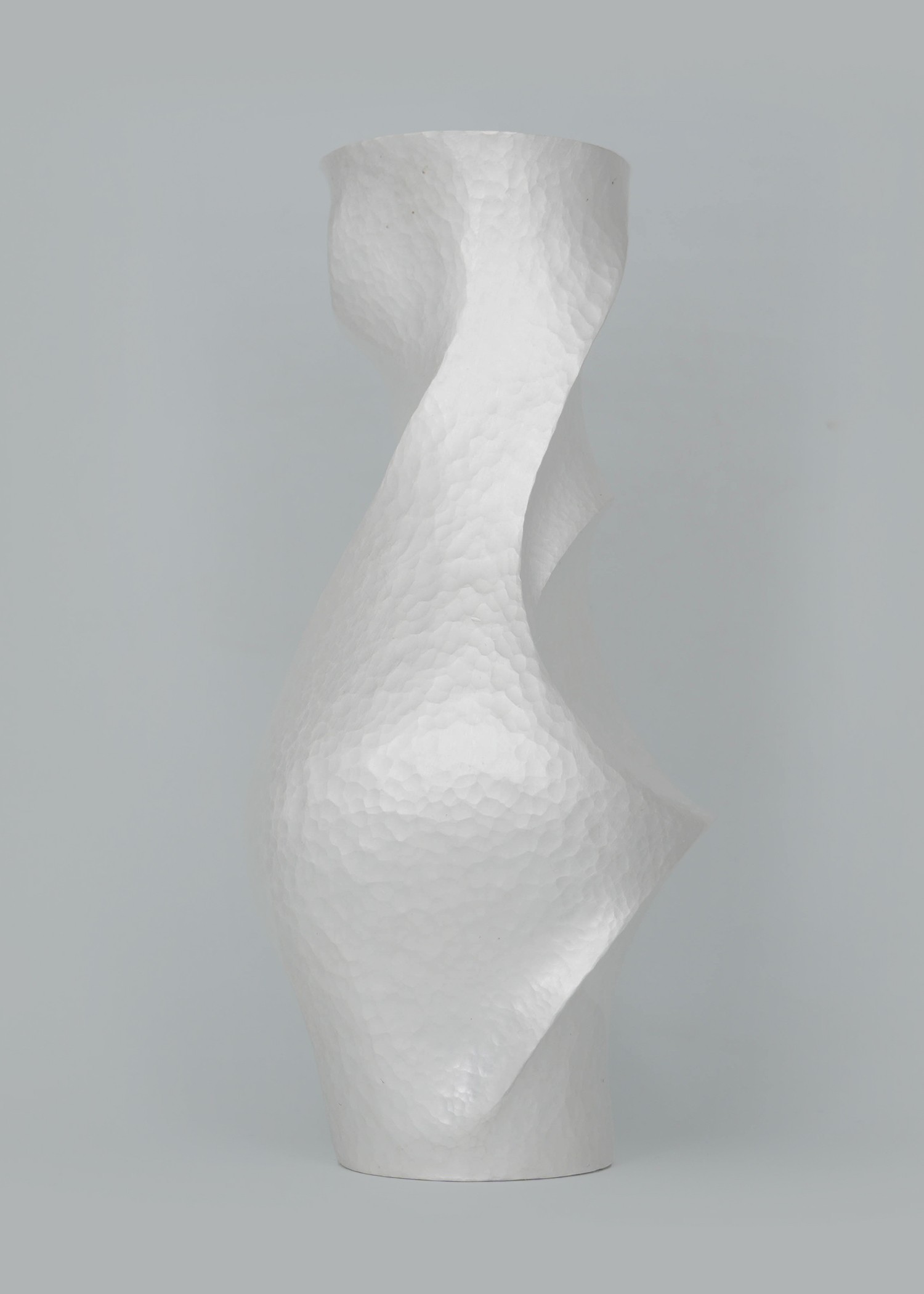 Constrict by Yuxin Song, hand-forged fine silver vase. Contemporary silversmithing and metalwork by artist Yuxin Song