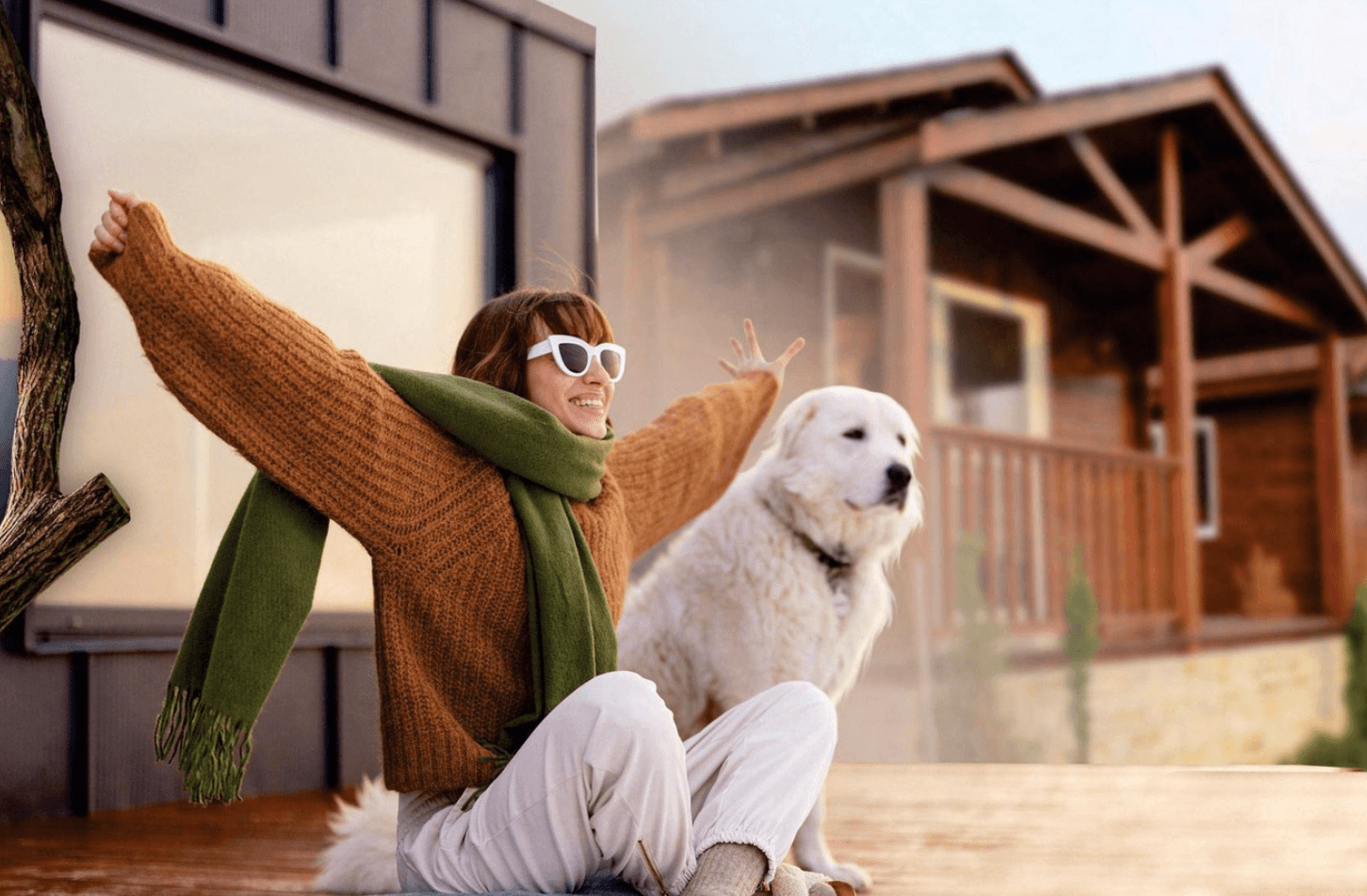 <img src="your-image-url.jpg" alt=".White furry dog sitting with a man near a wooden house, embers glowing nearby." loading="lazy">