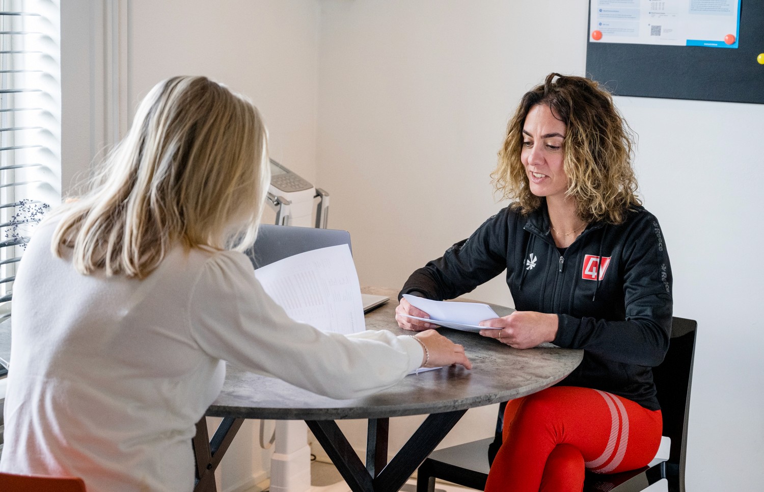 Woman pouring vitamins in her hand