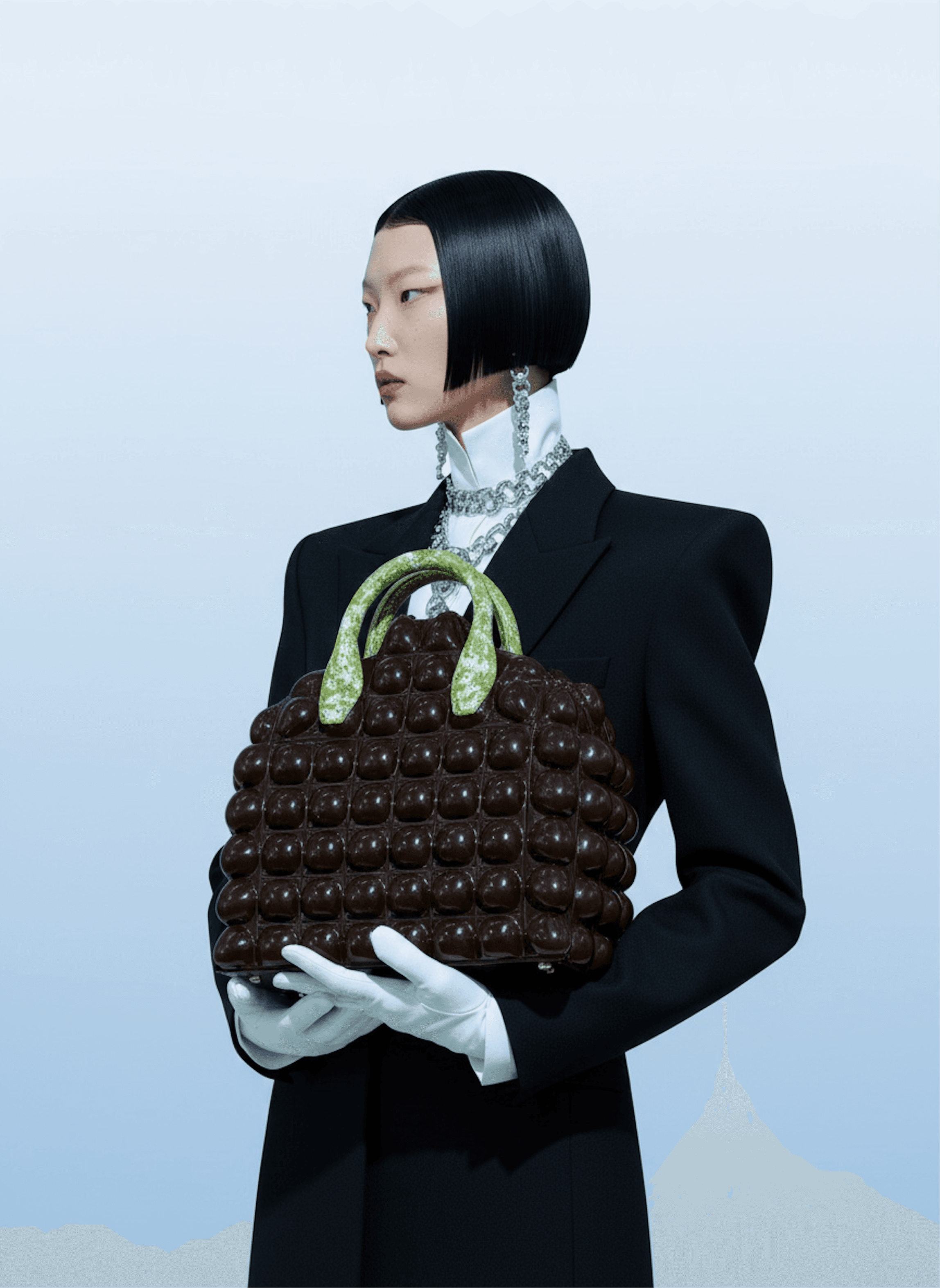 man sitting on gray concrete wall