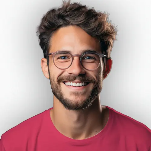 A businessman working on his laptop in an office.