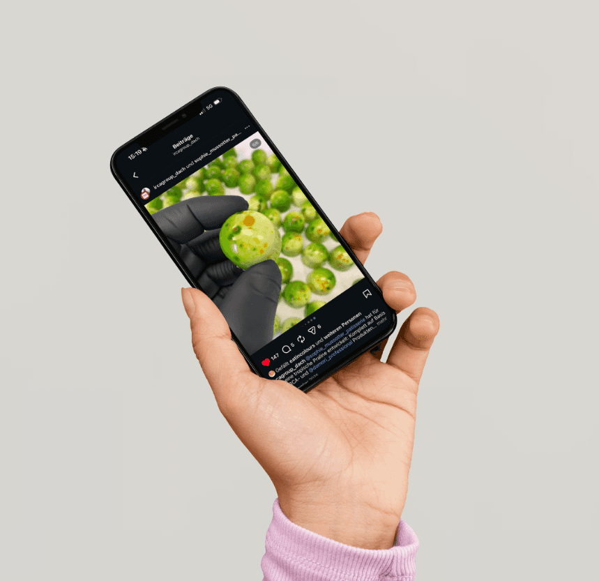 Minimalist brushed-steel chair in a white corner studio—industrial, brutalist modern furniture.