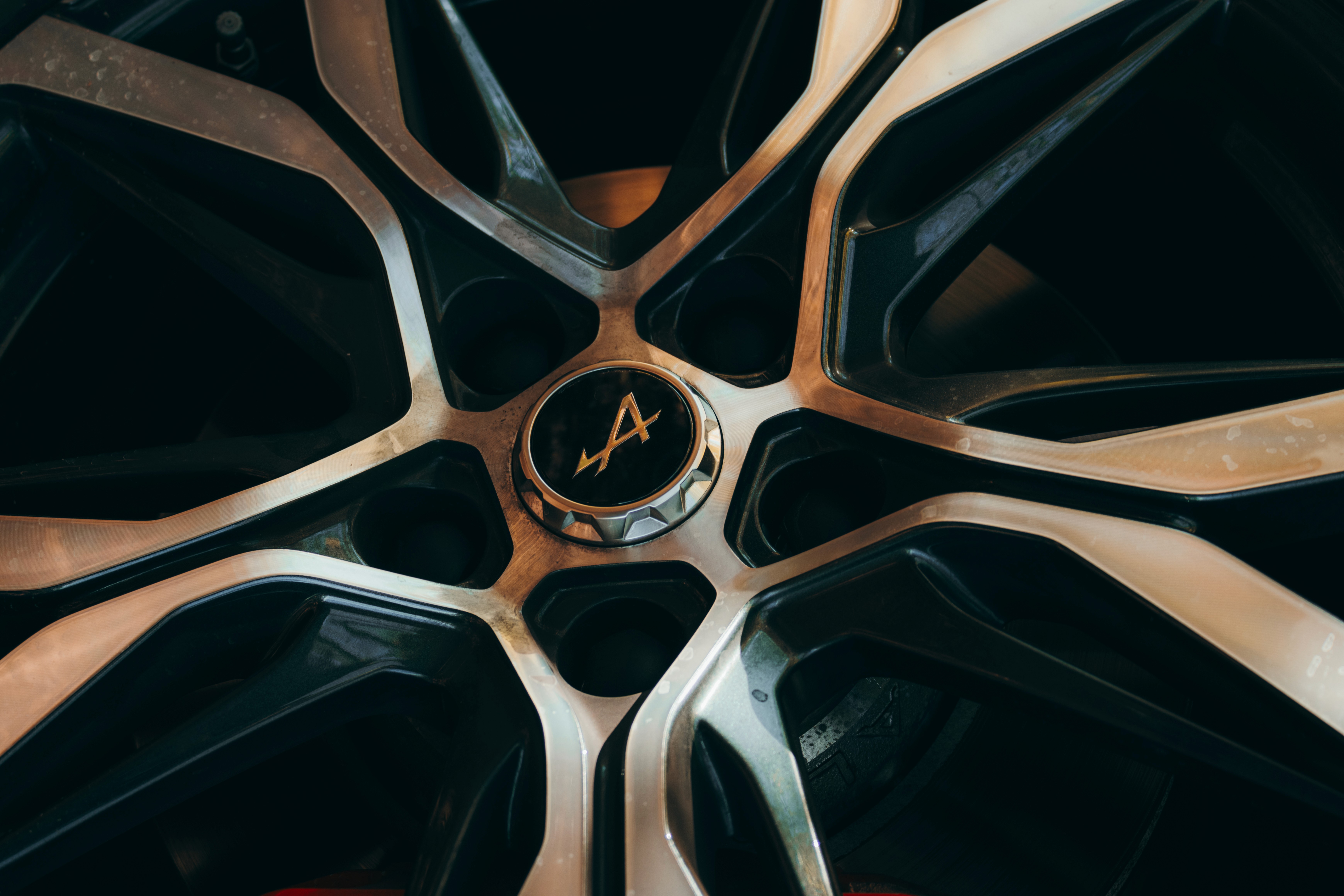 Woman's portrait with fiery light effects. The model has light skin and wears a colorful top with a high collar.