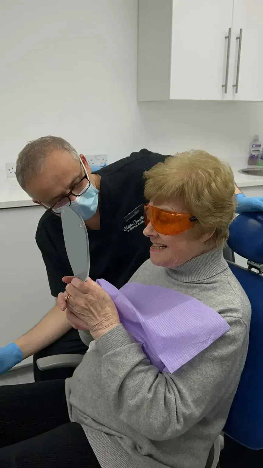 Dr Yasser talking about his patients teeth with her